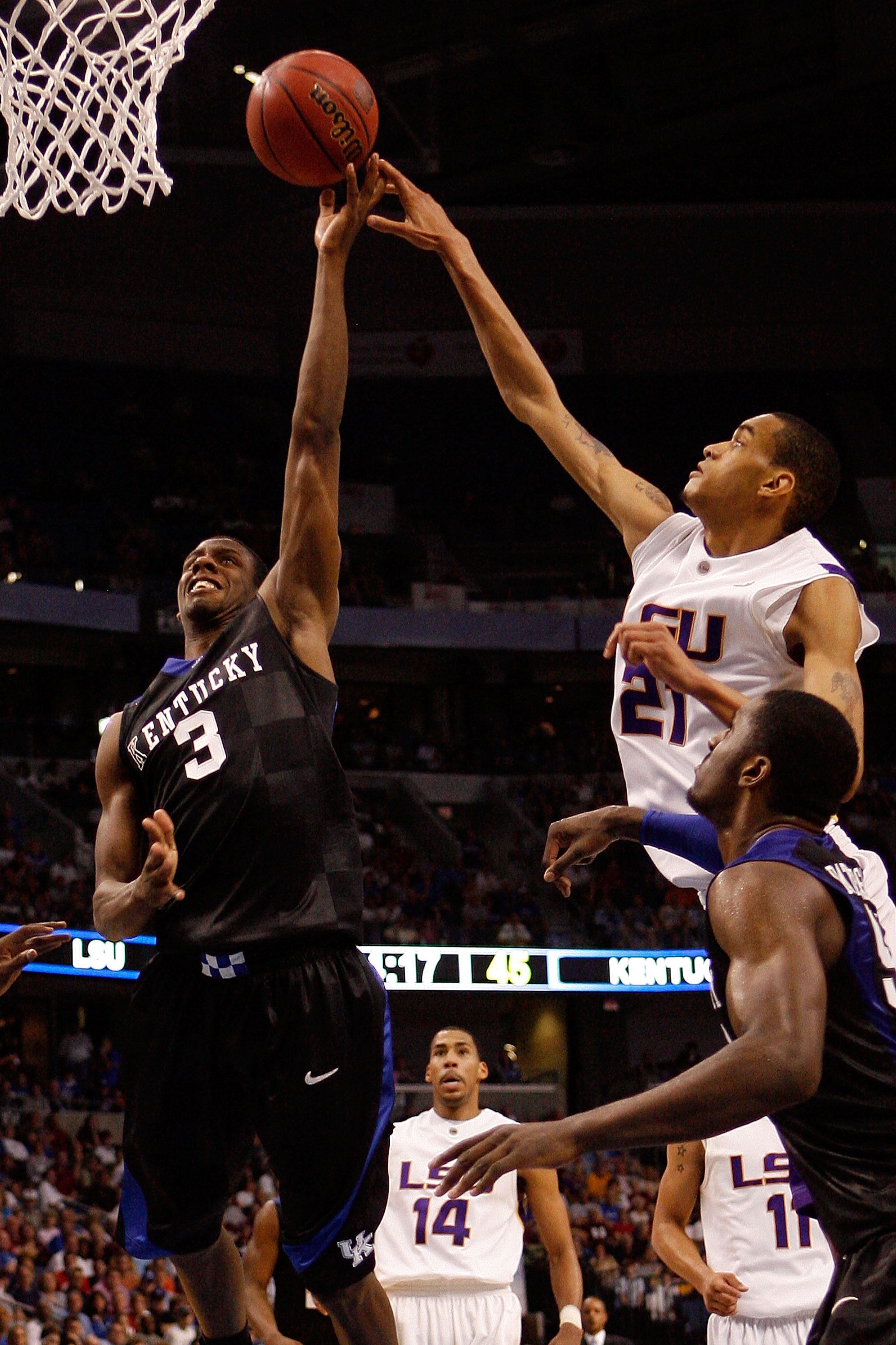 TAMPA, FL - MARCH 13:  Kevin Galloway #3 of the Kentucky Wildcats makes a shot over Chris Johnson #21 of the Louisiana State University Tigers during the second round of the SEC Men's Basketball Tournament on March 13, 2009 at The St. Pete Times Forum in 