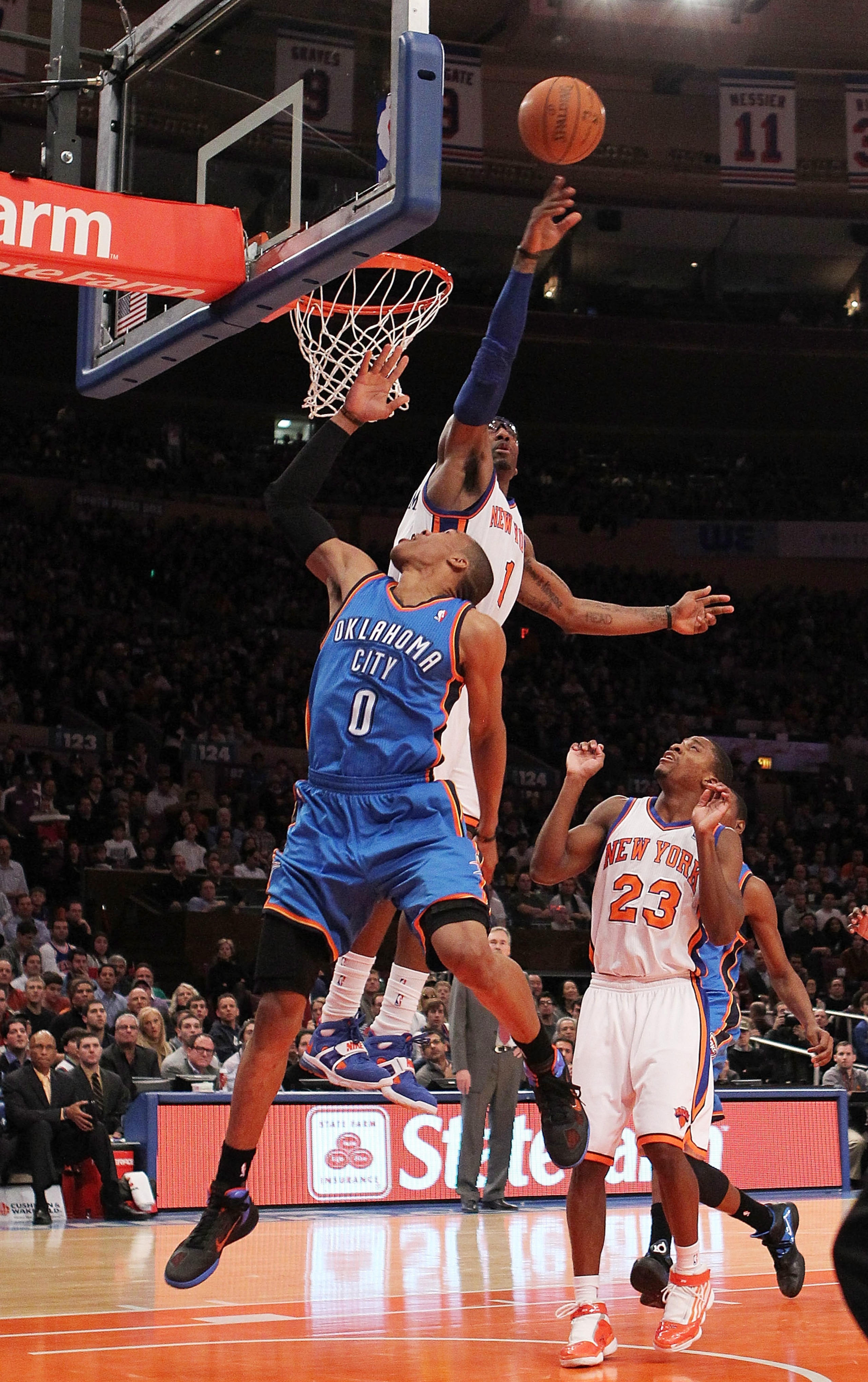 NEW YORK, NY - DECEMBER 22:  Amar'e Stoudemire #1 of the New York Knicks blocks a shot by Russell Westbrook #0 of the Oklahoma City Thunder at Madison Square Garden on December 22, 2010 in New York City.   NOTE TO USER: User expressly acknowledges and agr