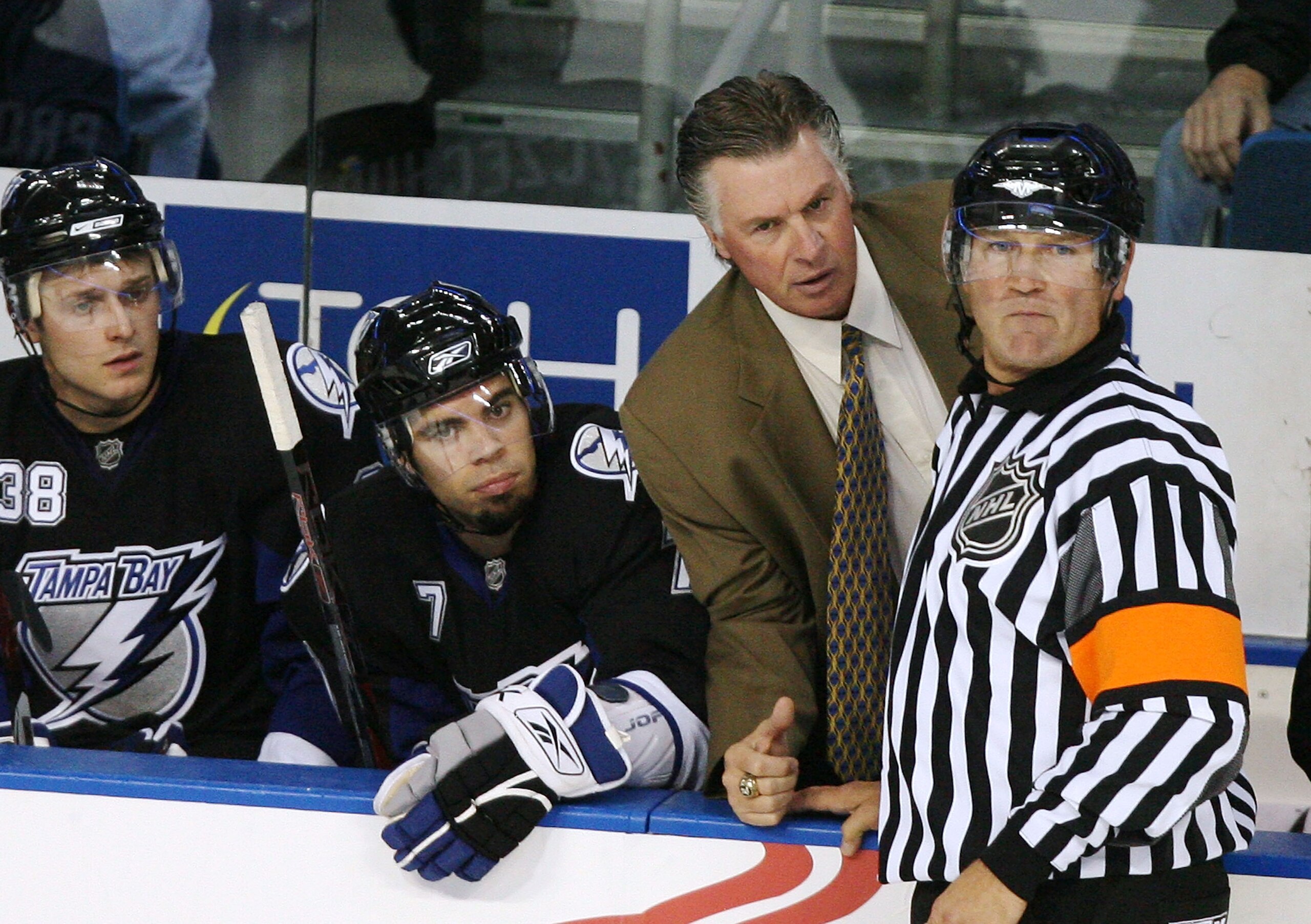 TAMPA, FL - SEPTEMBER 22:  Head coach Barry Melrose of the Tampa Bay Lightning discusses a call with referee Don Koharski #12 during action against the Pittsburgh Penguins in a preseason game at the St. Pete Times Forum on September 22, 2008 in Tampa, Flo