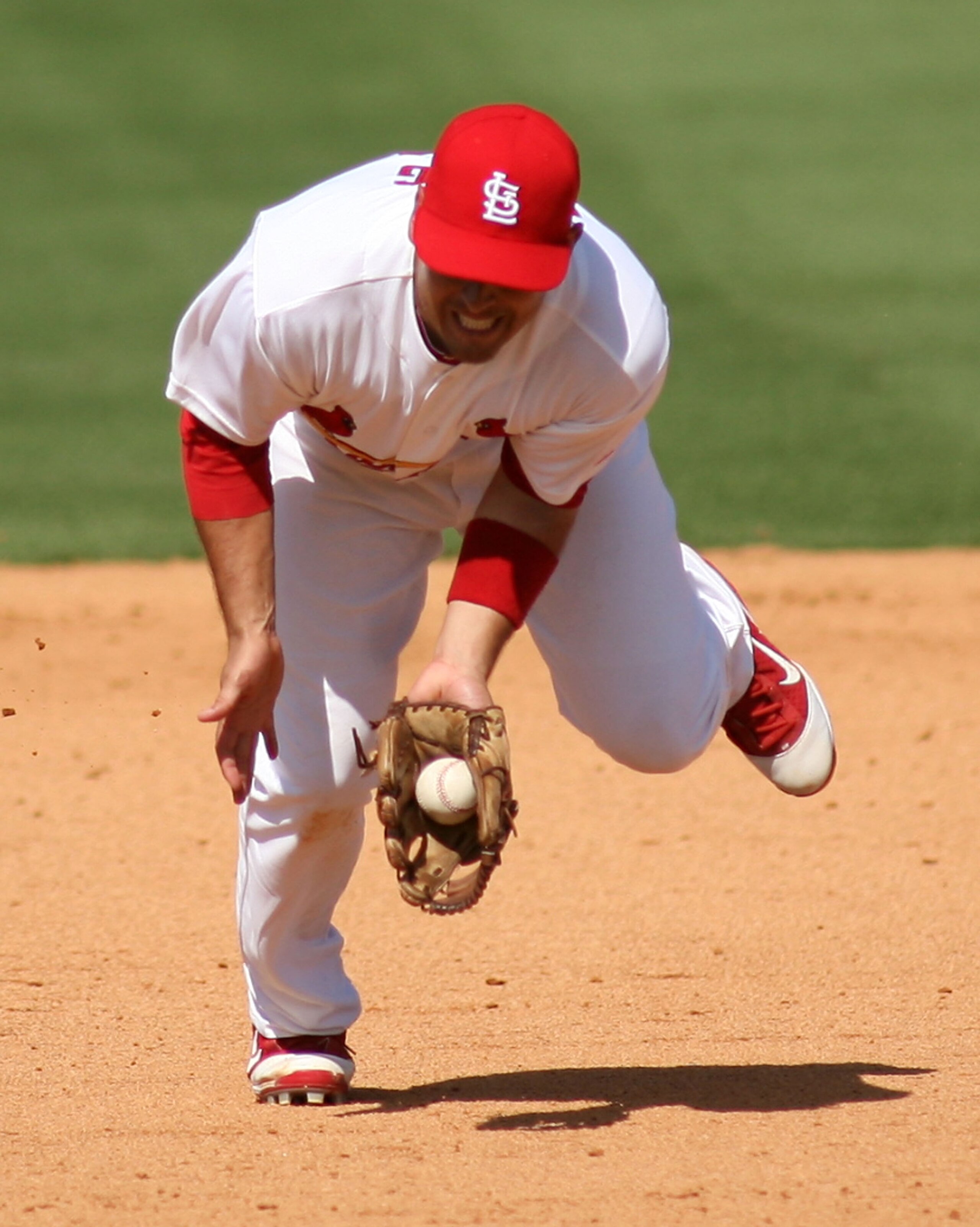 JUPITER, FL - FEBRUARY 28:  Third baseman Allen Craig #21 of the St. Louis Cardinals plays the field against the Florida Marlins at Roger Dean Stadium on February 28, 2011 in Jupiter, Florida.  (Photo by Marc Serota/Getty Images)