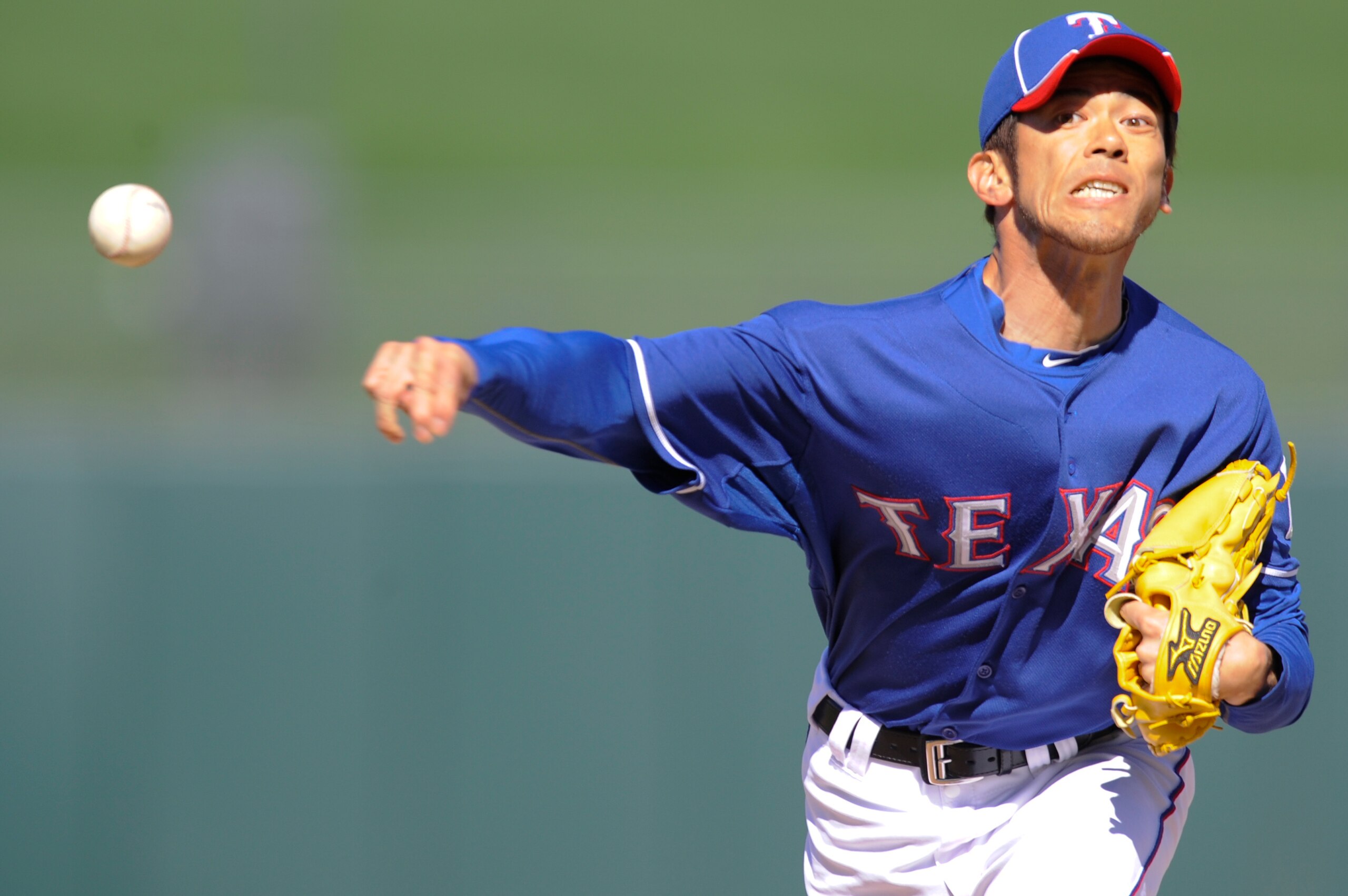 SURPISE, AZ - FEBRUARY 27: Yoshinori Tateyama #22 of the Texas Rangers pitches during a spring training game against the Kansas City Royals at Surprise Stadium on February 27, 2011 in Surprise, Arizona. (Photo by Rob Tringali/Getty Images)