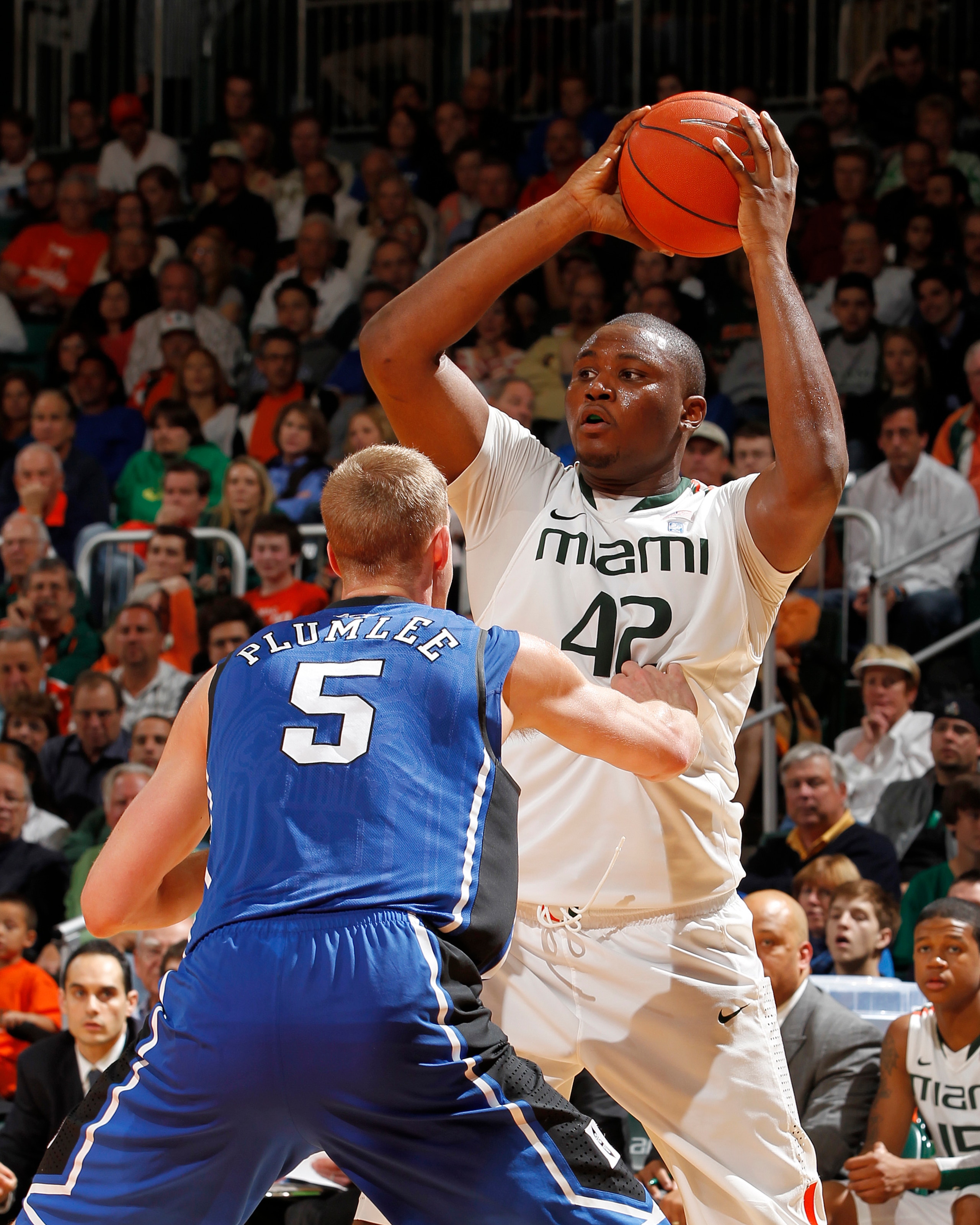 CORAL GABLES, FL - FEBRUARY 13: Reggie Johnson #42 of the Miami Hurricanes attempts to pass the ball while being defended by Mason Plumlee #5 of the Duke Blue Devils on February 13, 2011 at the BankUnited Center in Coral Gables, Florida. (Photo by Joel Au