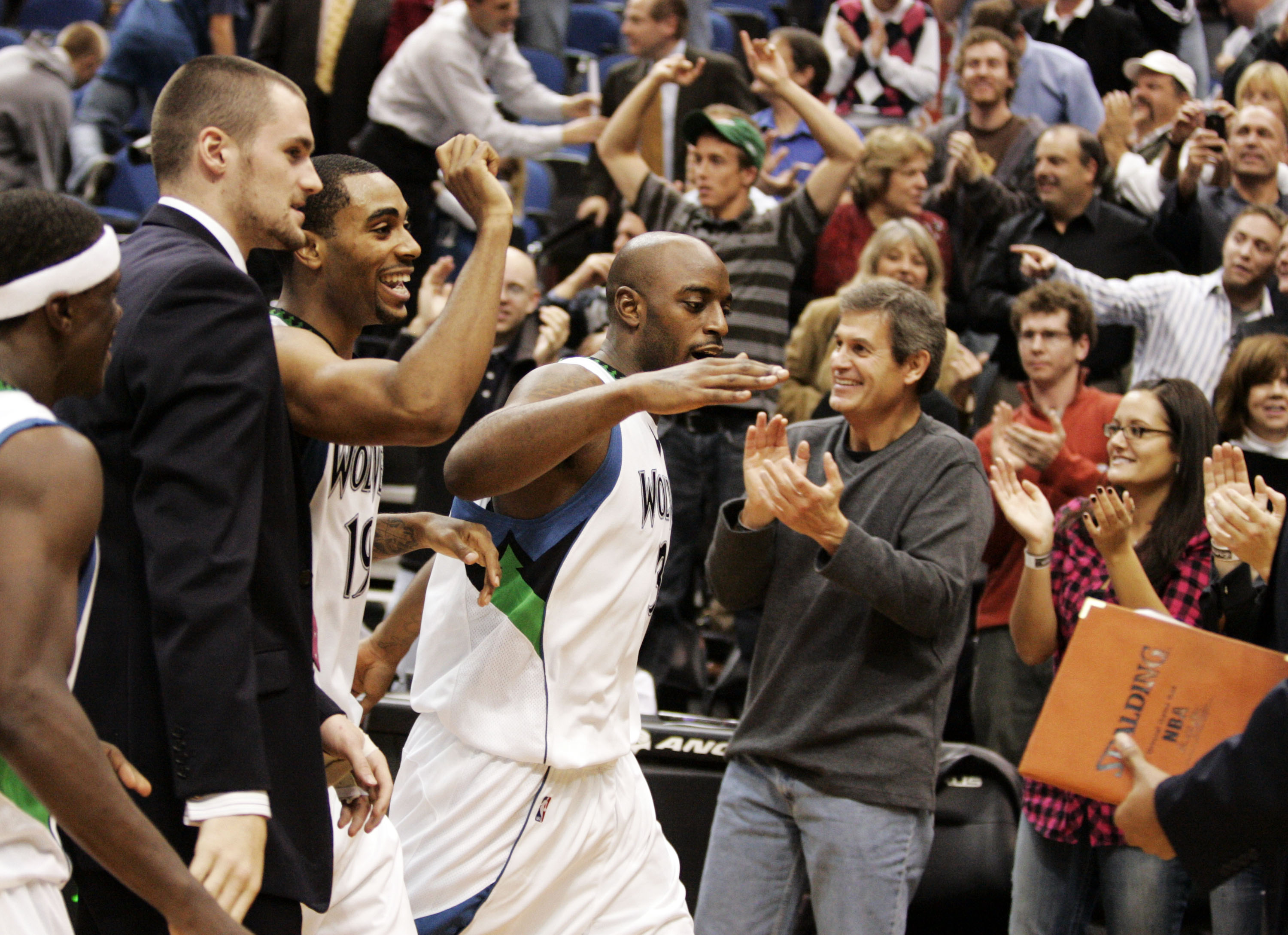 MINNEAPOLIS, MN - OCTOBER 28: Damien Wilkins #3 of the Minnesota Timberwolves celebrates with teammates and fans after scoring the game-winning shot at the buzzer against the New Jersey Nets at the Target Center on October 28, 2009 in Minneapolis, Minneso MINNEAPOLIS, MN - OCTOBER 28: Damien Wilkins #3 of the Minnesota Timberwolves celebrates with teammates and fans after scoring the game-winning shot at the buzzer against the New Jersey Nets at the Target Center on October 28, 2009 in Minneapolis, Minneso