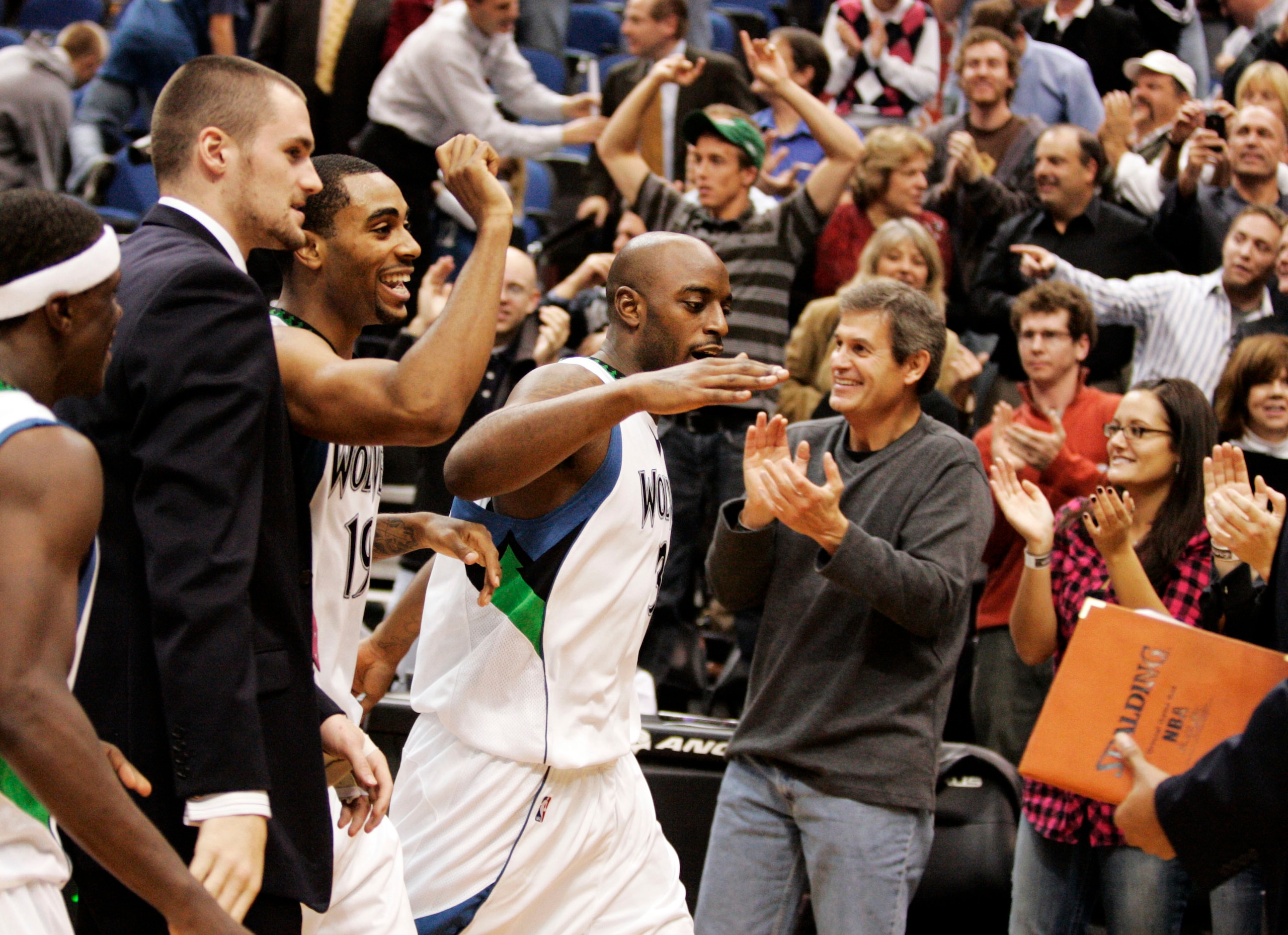 MINNEAPOLIS, MN - OCTOBER 28: Damien Wilkins #3 of the Minnesota Timberwolves celebrates with teammates and fans after scoring the game-winning shot at the buzzer against the New Jersey Nets at the Target Center on October 28, 2009 in Minneapolis, Minneso