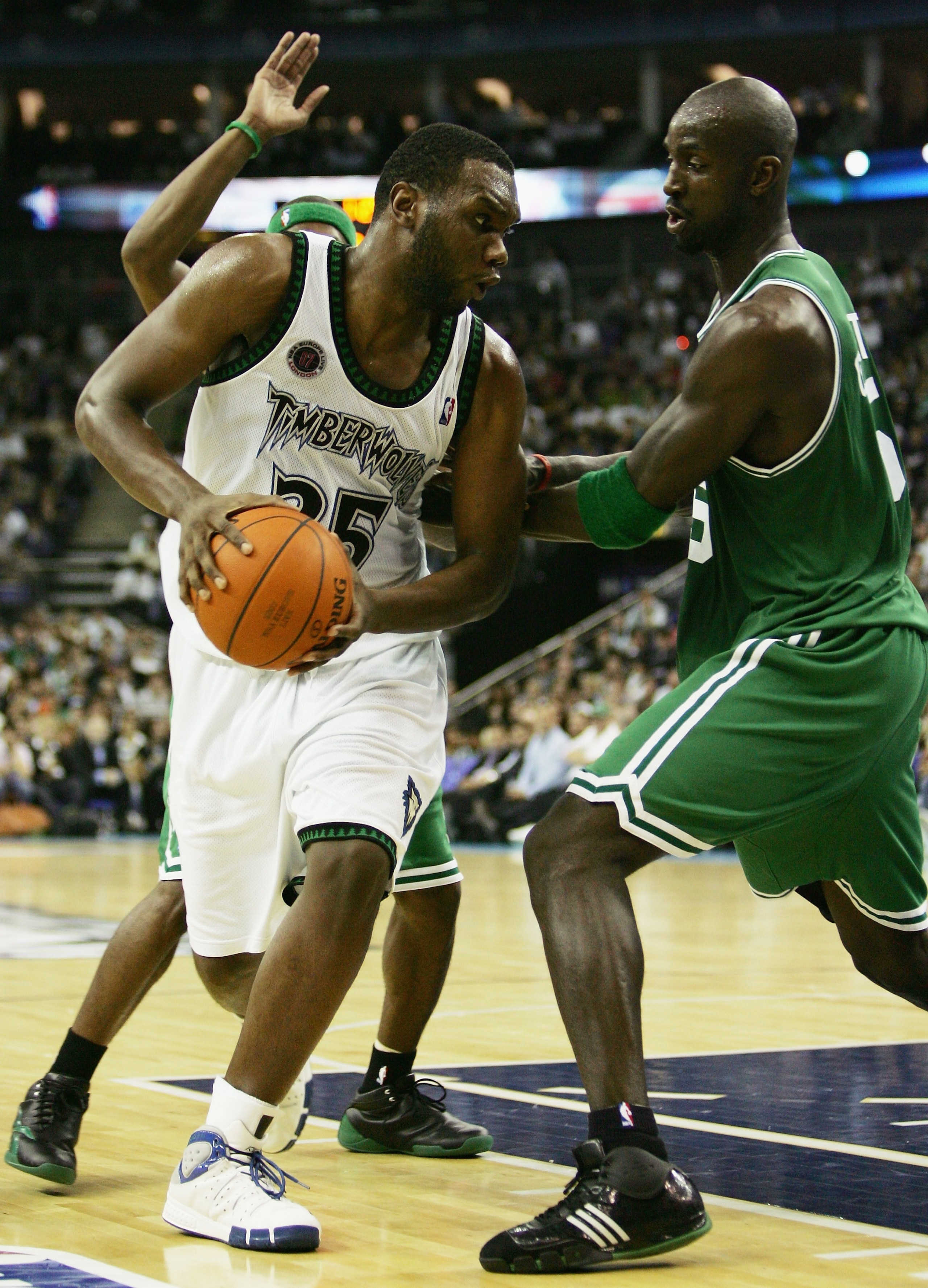 LONDON - OCTOBER 10:  Al Jefferson #25 of Minnesota is challenged by Kevin Garnett (R) of Boston during NBA Europe Live 2007 Tour match between the Boston Celtics and the Minnesota Timberwolves at the O2 Arena on October 10, 2007 in London, England.  NOTE