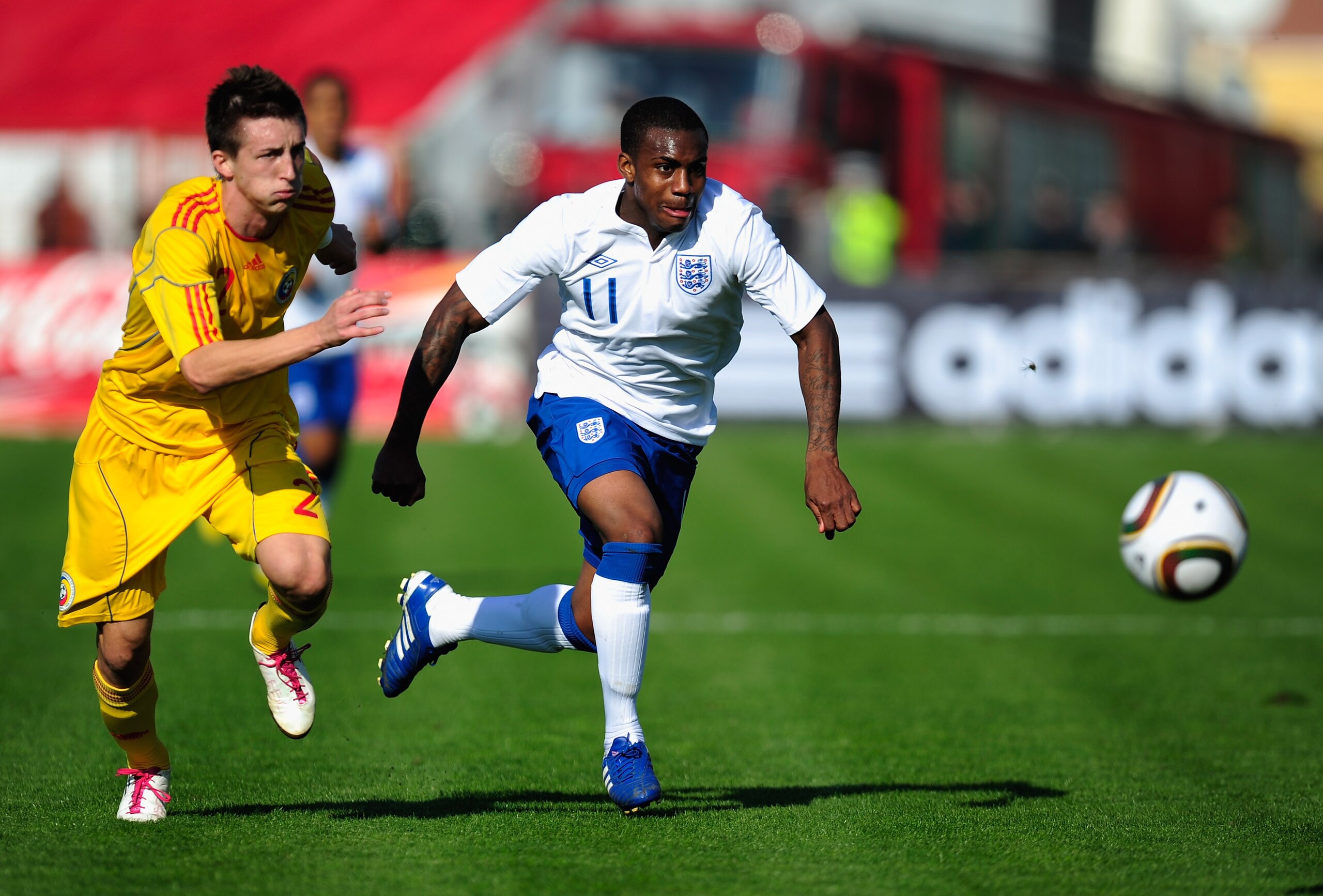 BOTOSANI, ROMANIA - OCTOBER 12:  Daniel Rose of England U21 battles with Cornel Rapa of Romania U21 during the UEFA Euro 2011 U21 Championship play-off, second leg match between Romania U21 and England U21 at the Municipal Stadium Botosani on October 12,