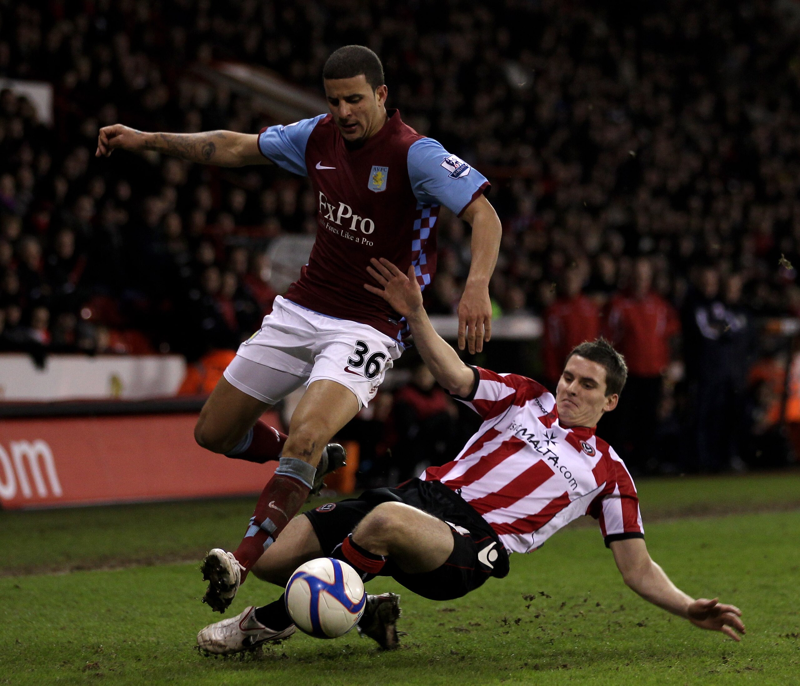 SHEFFIELD, ENGLAND - JANUARY 08:  David McAllister of Sheffield United (R) challenges Kyle Walker of Aston Villa during the FA Cup sponsored by E.ON 3rd Round match between Sheffield United and Aston Villa at Bramall Lane on January 8, 2011 in Sheffield,