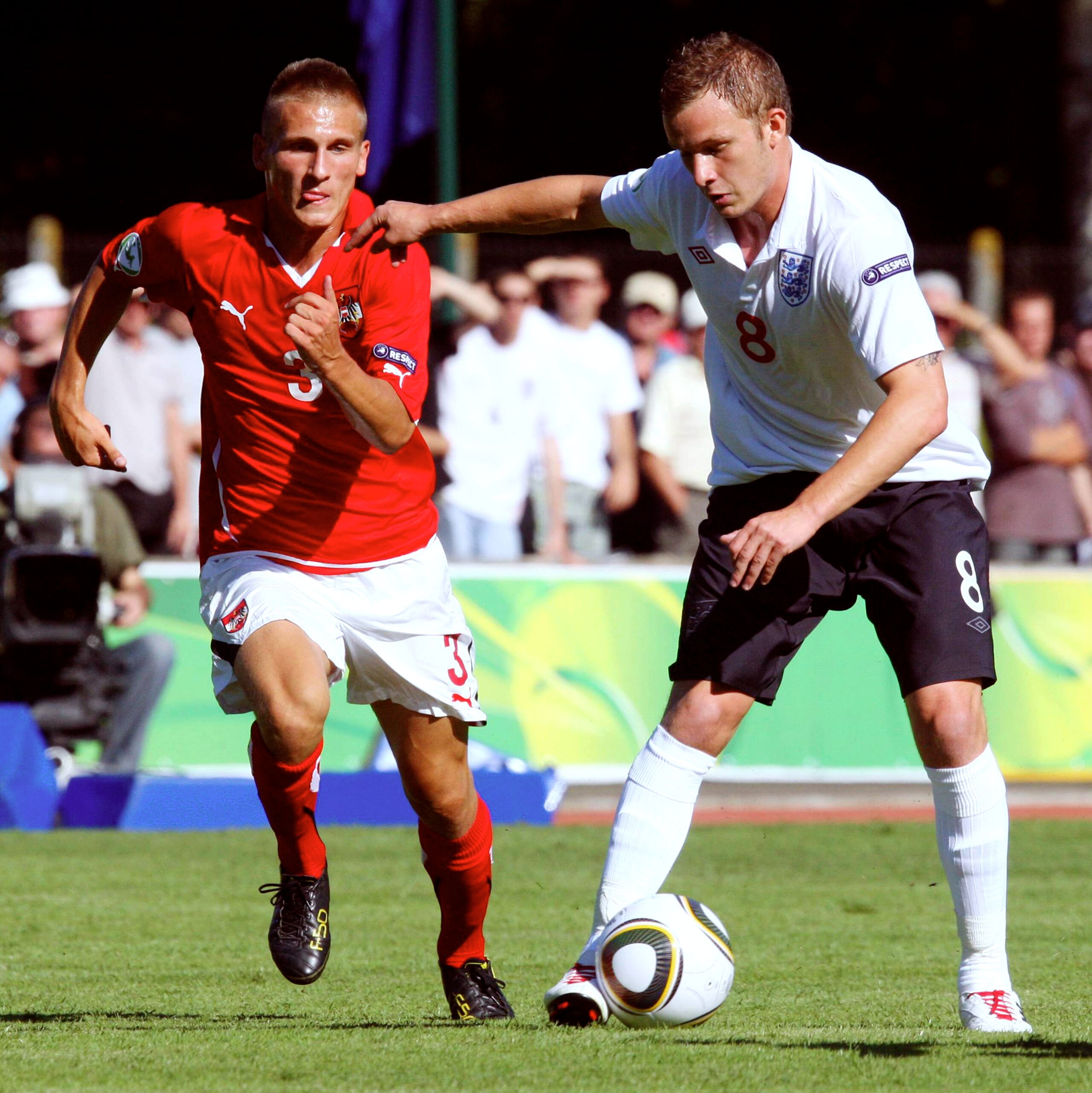 FLERS, FRANCE - JULY 18: Emir Dilaver of Austria and Dean Parrett of England in action during the UEFA European Under-19 Championship Final Tournament Group A match between Austria and England at Stade du Haze on July 18, 2010 in Flers, France.  (Photo by