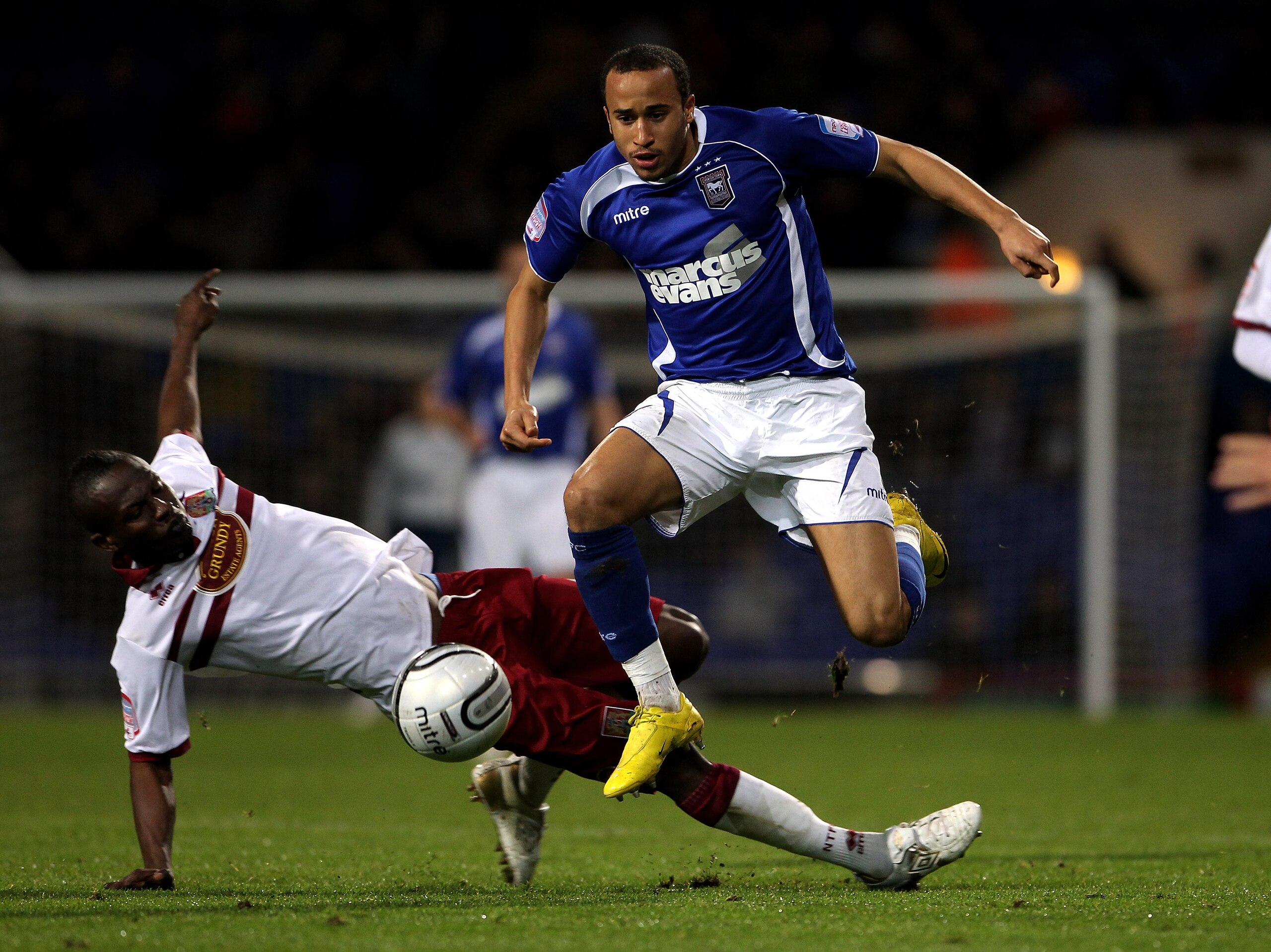 IPSWICH, ENGLAND - OCTOBER 26:  Andros Townsend of Ipswich Town moves away from Abdul Osman during the Carling Cup fourth round match between Ipswich Town and Northampton Town at Portman Road on October 26, 2010 in Ipswich, England.  (Photo by David Roger