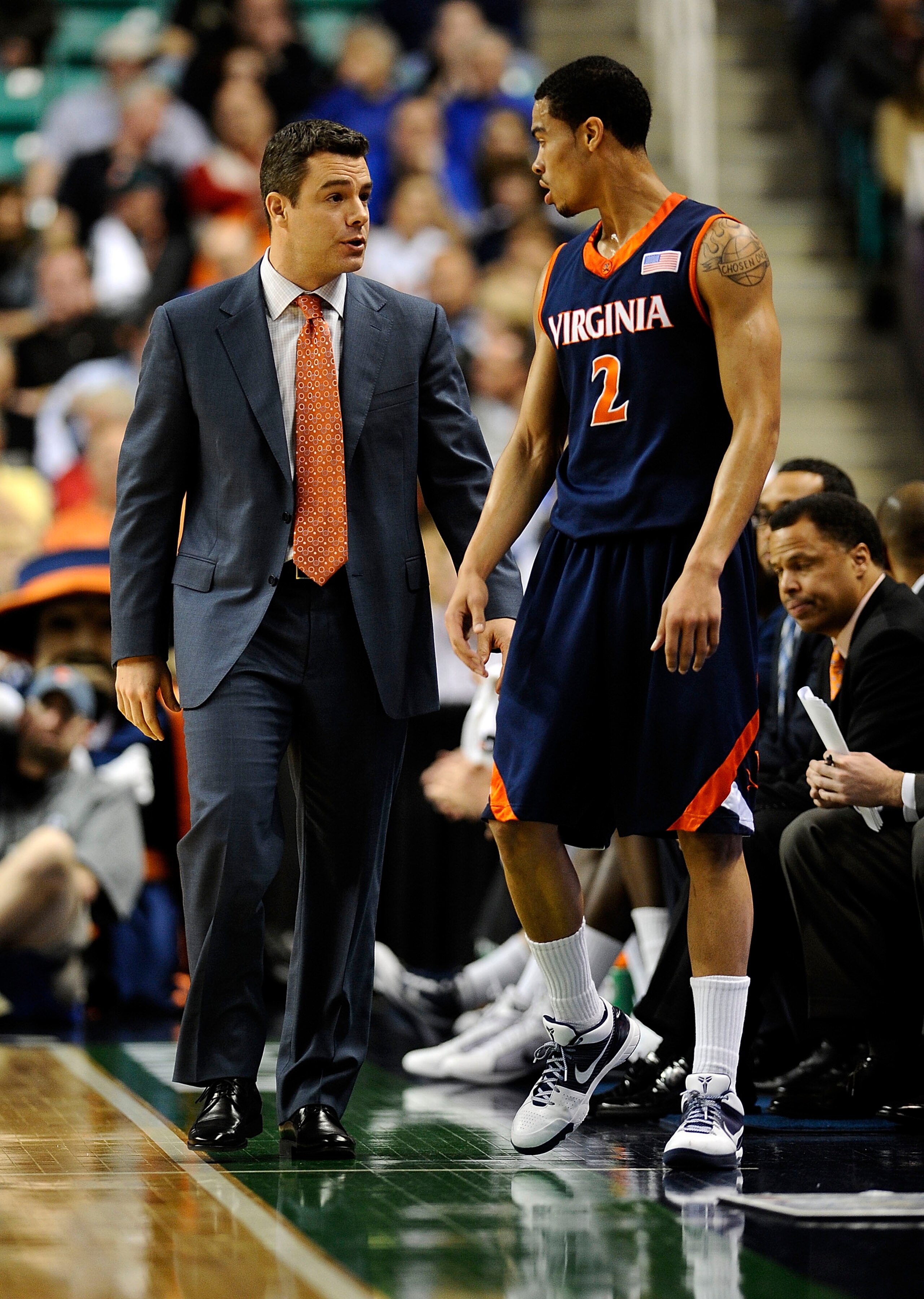 GREENSBORO, NC - MARCH 12:  Mustapha Farrakhan #2 and Tony Bennett, head coach of the University of Virginia Cavaliers confer in a quarterfinal game against the Duke Blue Devils in the 2010 ACC Men's Basketball Tournament at the Greensboro Coliseum on Mar