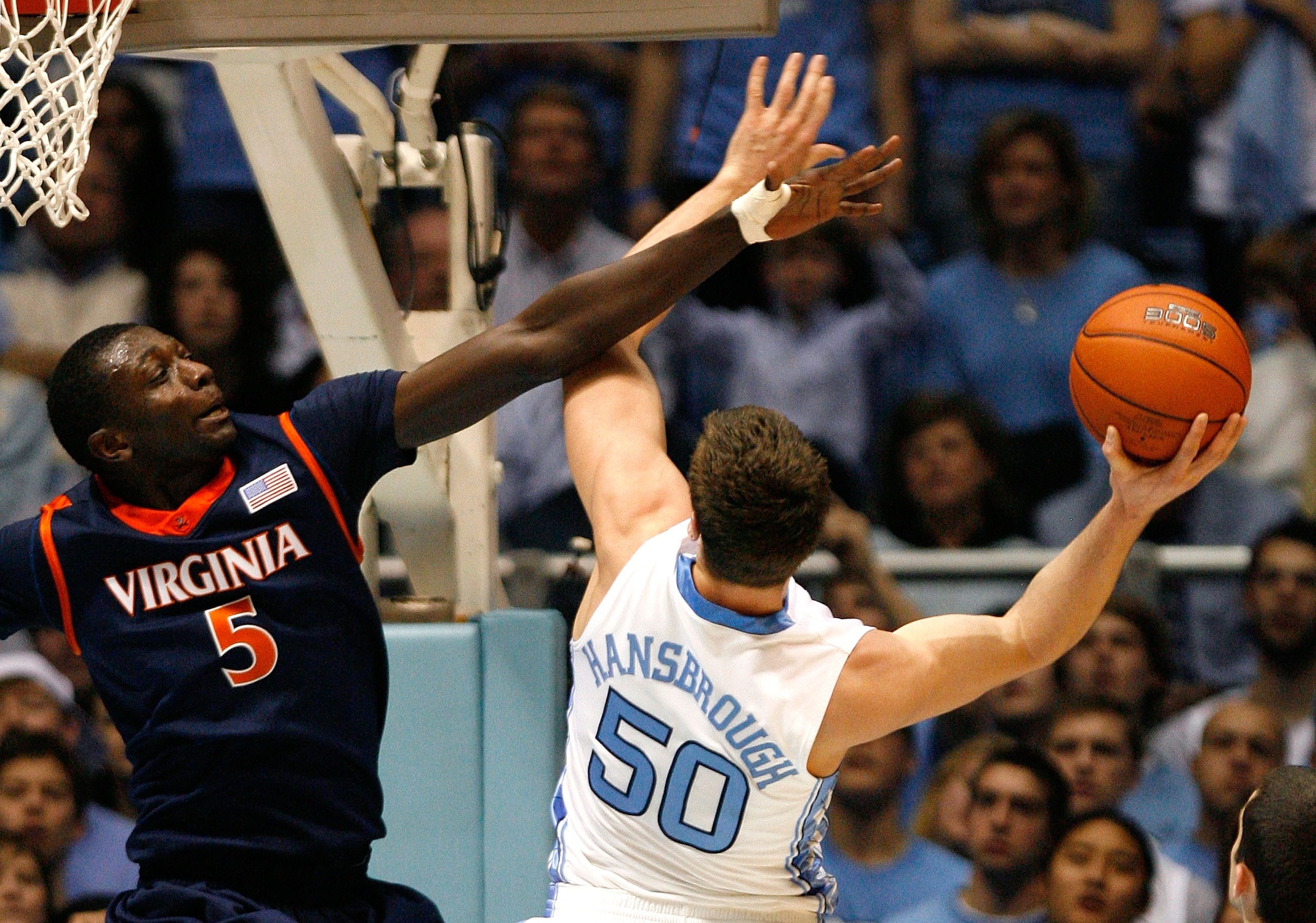 CHAPEL HILL, NC - FEBRUARY 07:  Assane Sene #5 of the Virginia Cavaliers defends against Tyler Hansbrough #50 of the North Carolina Tar Heels during the game on February 7, 2009 at the Dean E. Smith Center in Chapel Hill, North Carolina.  (Photo by Kevin