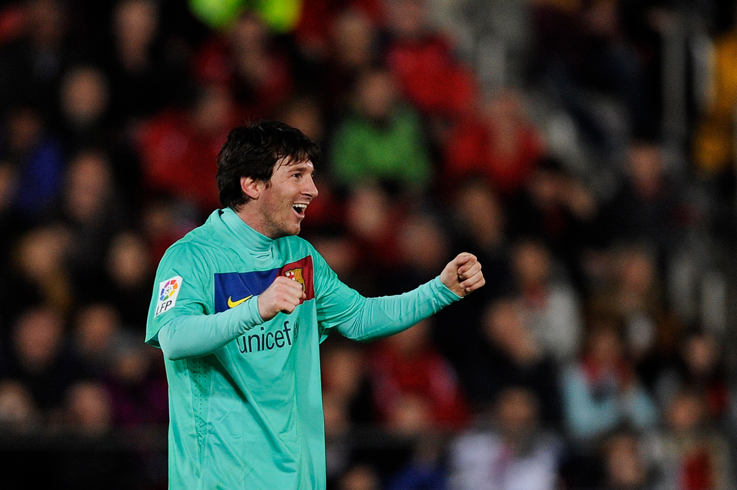 MALLORCA, SPAIN - FEBRUARY 26: Lionel Messi of Barcelona celebrates after scoring his first team's goal during the La Liga match between Mallorca and Barcelona at Iberstar Stadium on February 26, 2011 in Mallorca, Spain.  (Photo by David Ramos/Getty Image