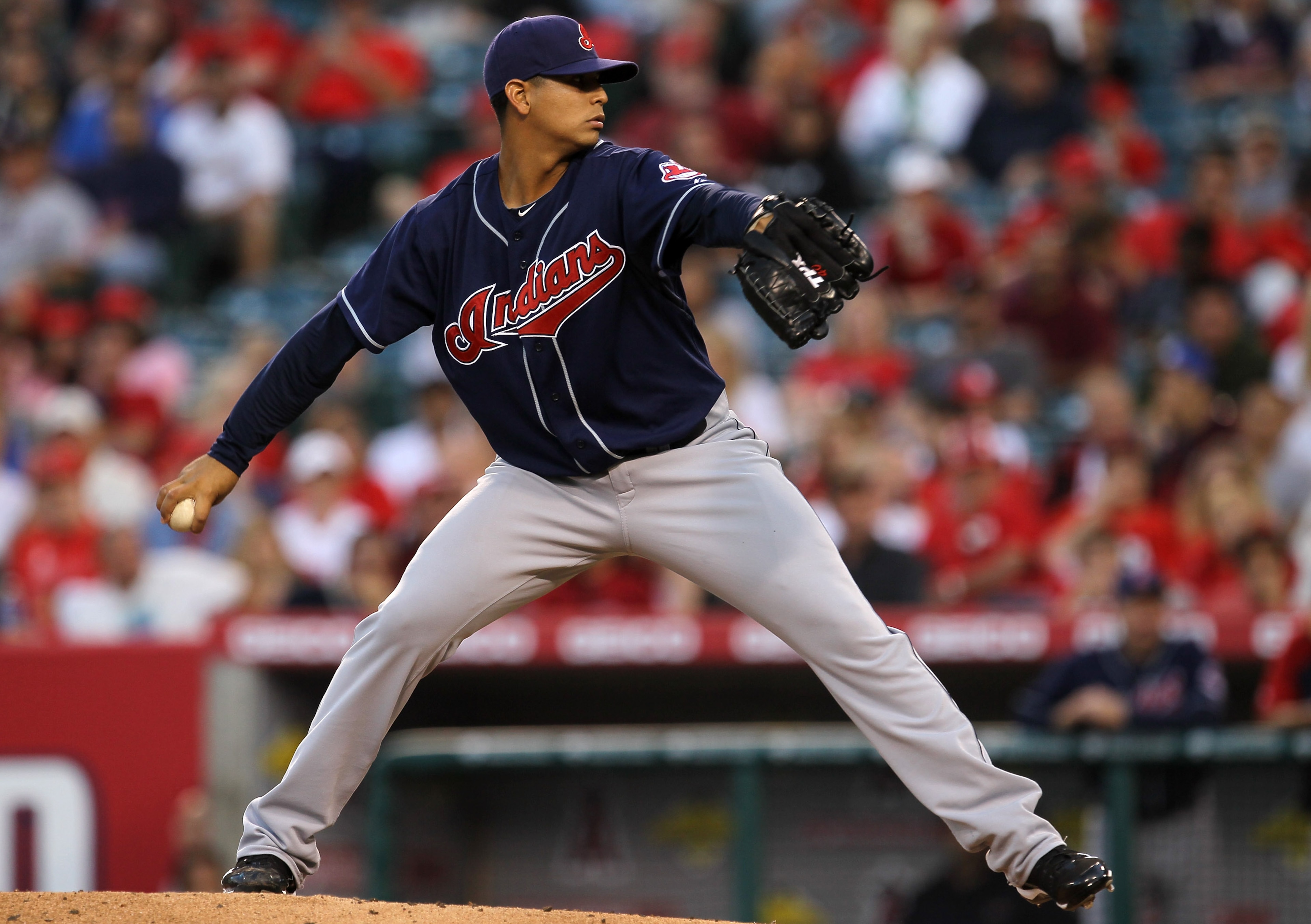 ANAHEIM, CA - SEPTEMBER 06:  Carlos Carrasco #59 of the Cleveland Indians throws a pitch against the Los Angeles Angels of Anaheim on September 6, 2010 at Angel Stadium in Anaheim, California.  (Photo by Stephen Dunn/Getty Images)