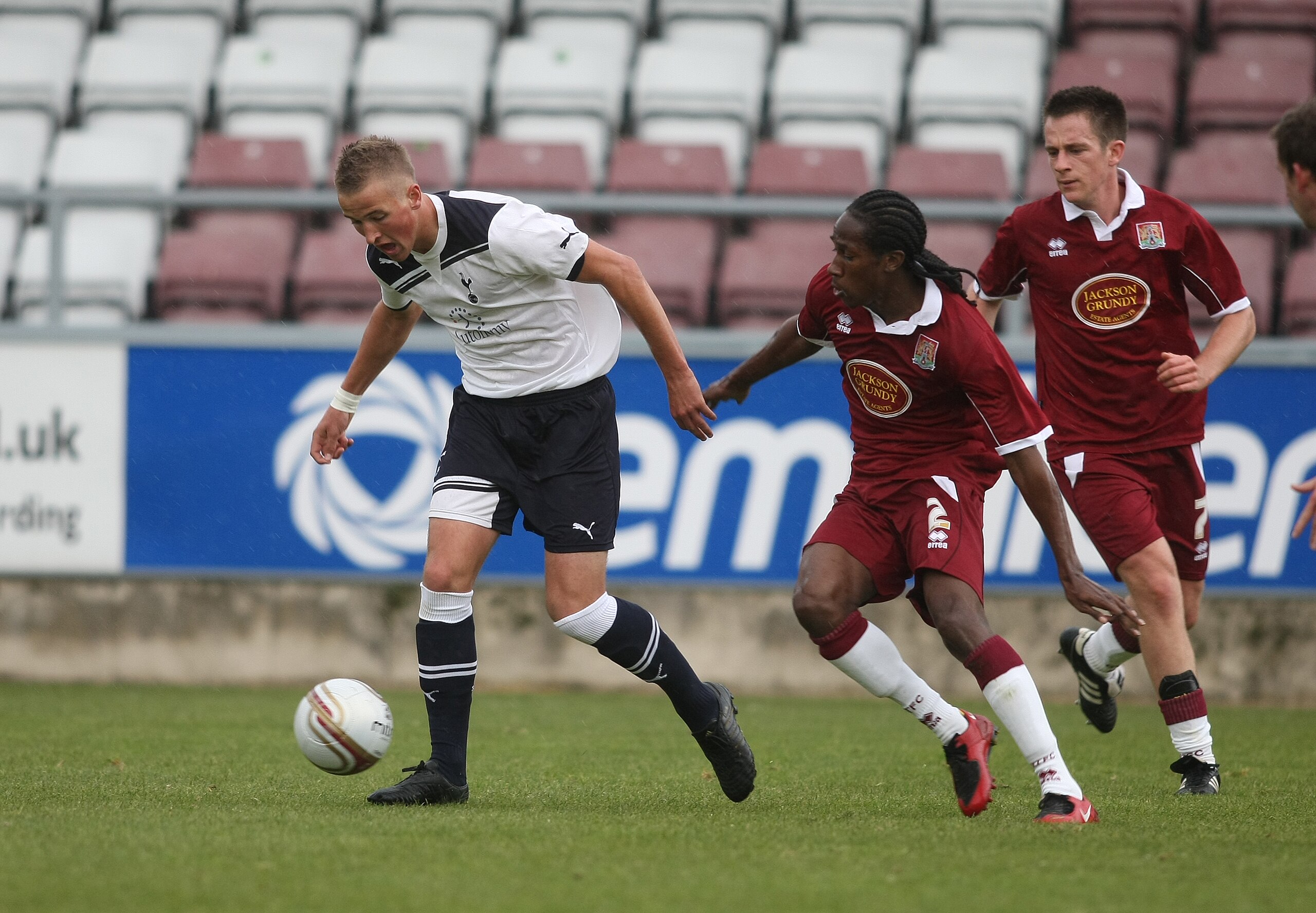 NORTHAMPTON, ENGLAND - OCTOBER 19:  Harry Kane of Tottenham Hotspur moves away with the ball from Paul Rodgers of Northampton Town during a Behind Closed Doors Friendly Match between Northampton Town and Tottenham Hotspur at Sixfields Stadium on October 1