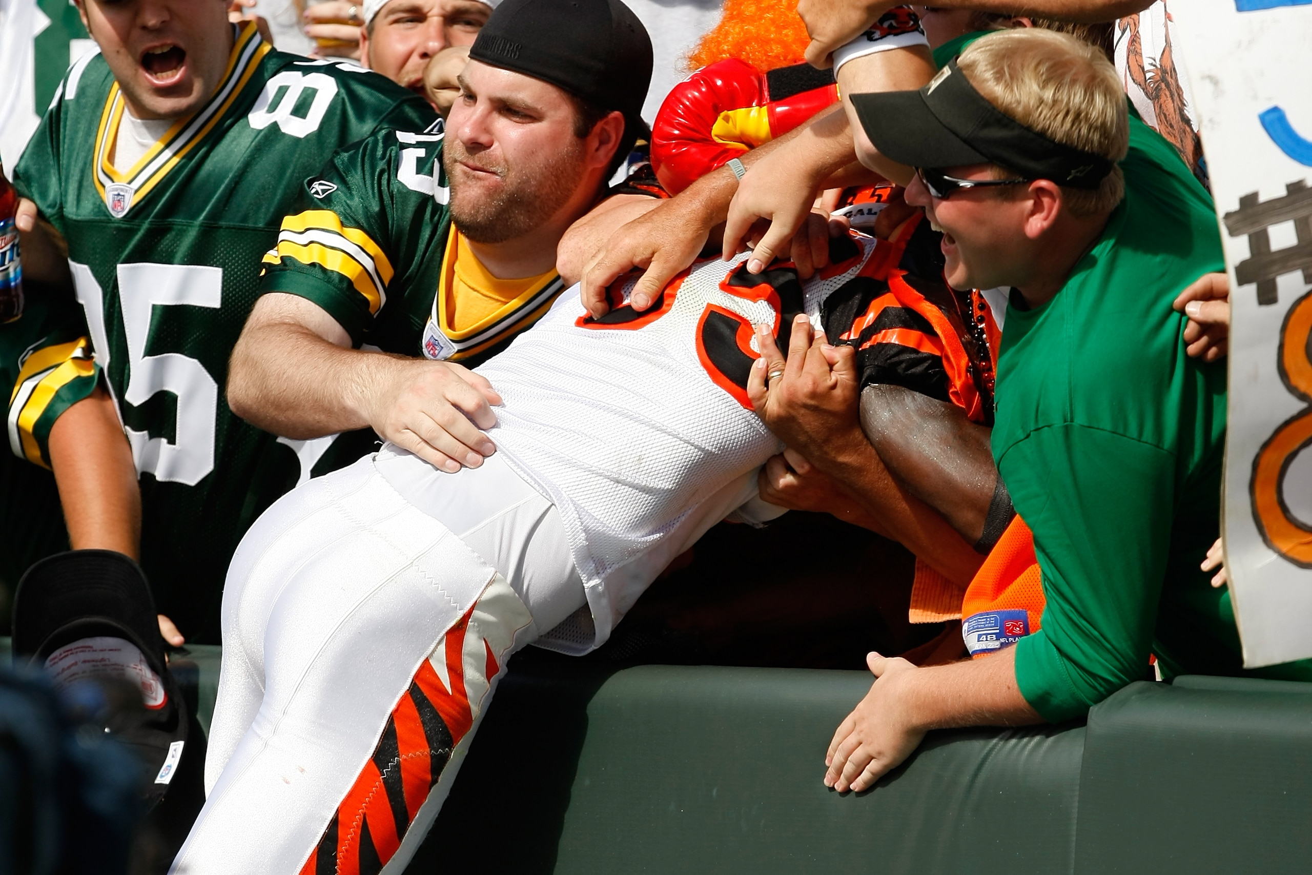 GREEN BAY, WI - SEPTEMBER 20: Wide receiver Chad Ochocinco #85 of the Cincinnati Bengals jumps in the stands to celebrate a touchdown as he does the Lambeau Leap against the Green Bay Packers at Lambeau Field on September 20, 2009 in Green Bay, Wisconsin.