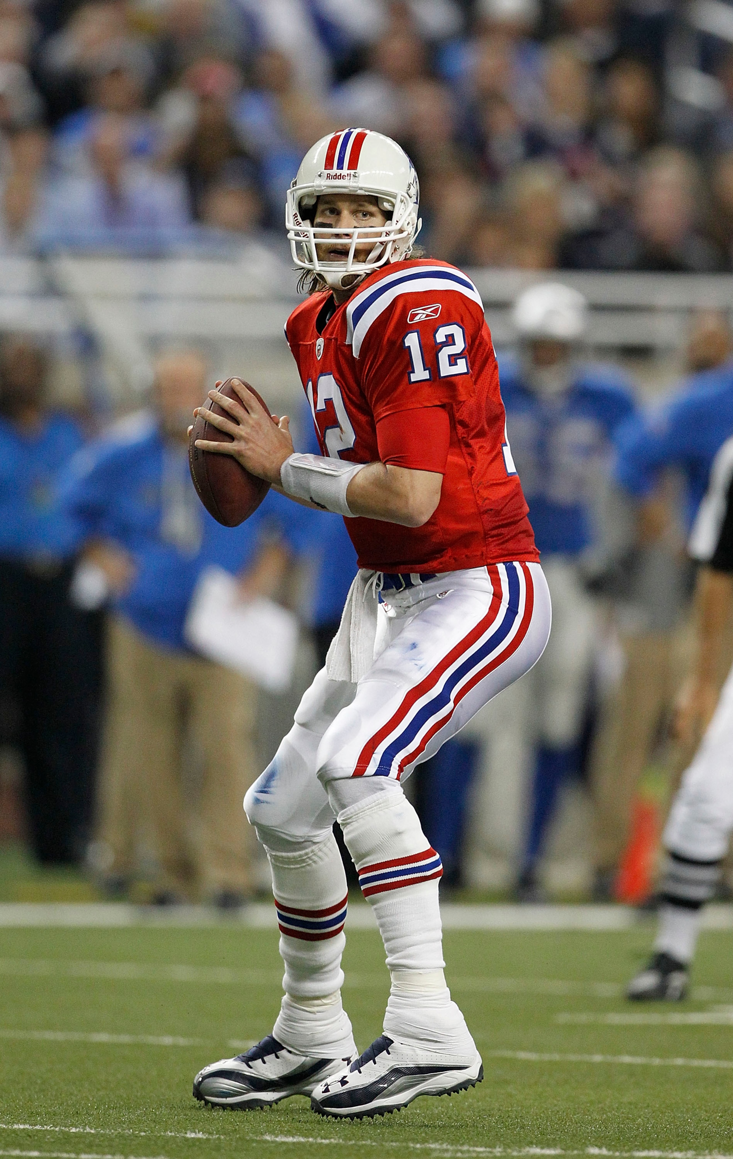 DETROIT - NOVEMBER 25:  Tom Brady #12 of the New England Patriots drops back to pass during the game against the Detroit Lions at Ford Field on November 25, 2010 in Detroit, Michigan. New England defeated Detroit 45-24.  (Photo by Leon Halip/Getty Images)