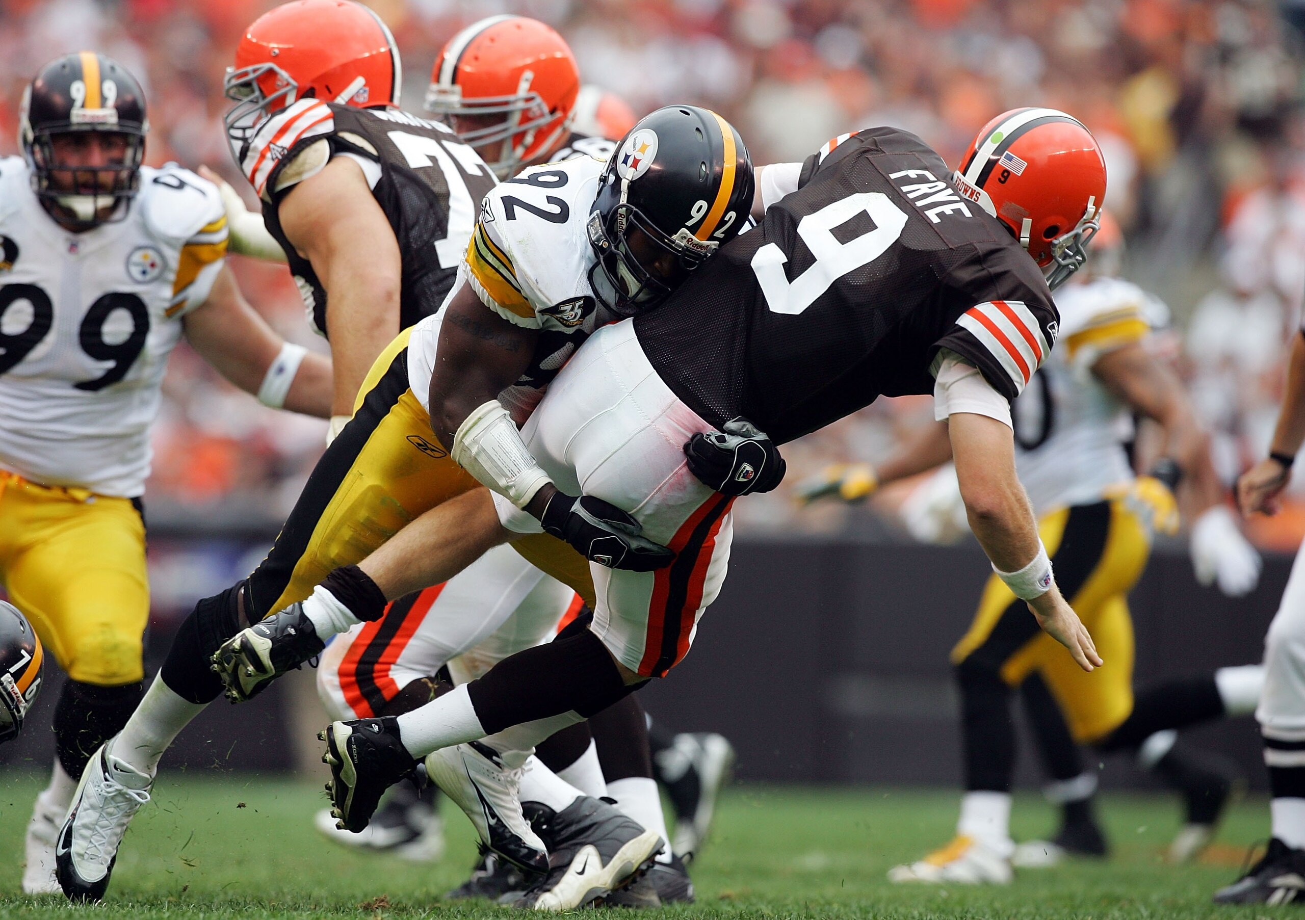 CLEVELAND - SEPTEMBER 9:  Charlie Frye #9 of the Cleveland Browns is sacked by James Harrison #92 of the Pittsburgh Steelers during their season opening game at Cleveland Browns Stadium September 9, 2007 in Cleveland, Ohio.  (Photo by Jim McIsaac/Getty Im