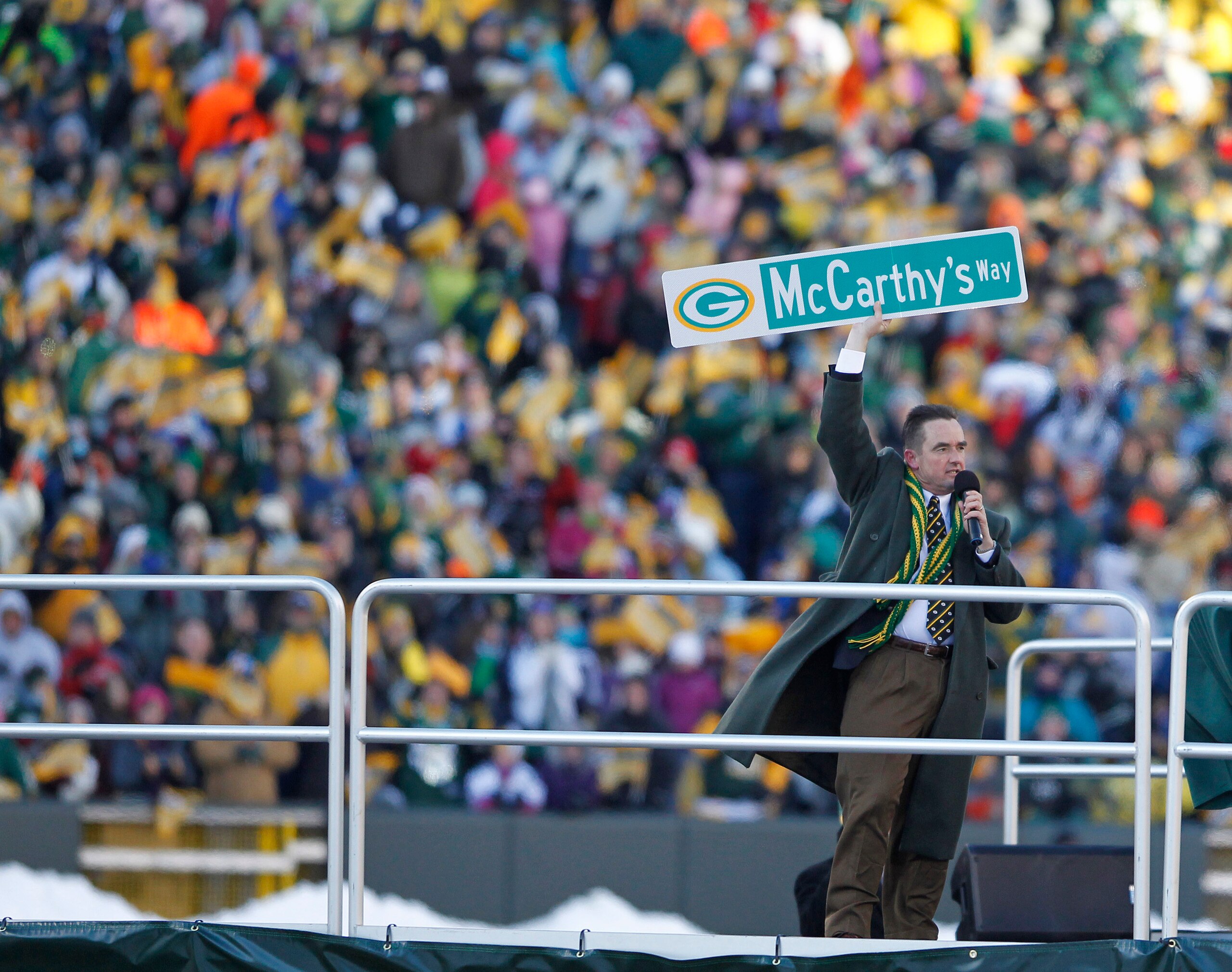 GREEN BAY, WI - FEBRUARY 08: Green Bay Mayor Jim Schmitt holds up a street sign for McCarthy's Way during the Packers victory ceremony at Lambeau Field on February 8, 2011 in Green Bay, Wisconsin.  (Photo by Matt Ludtke/Getty Images)