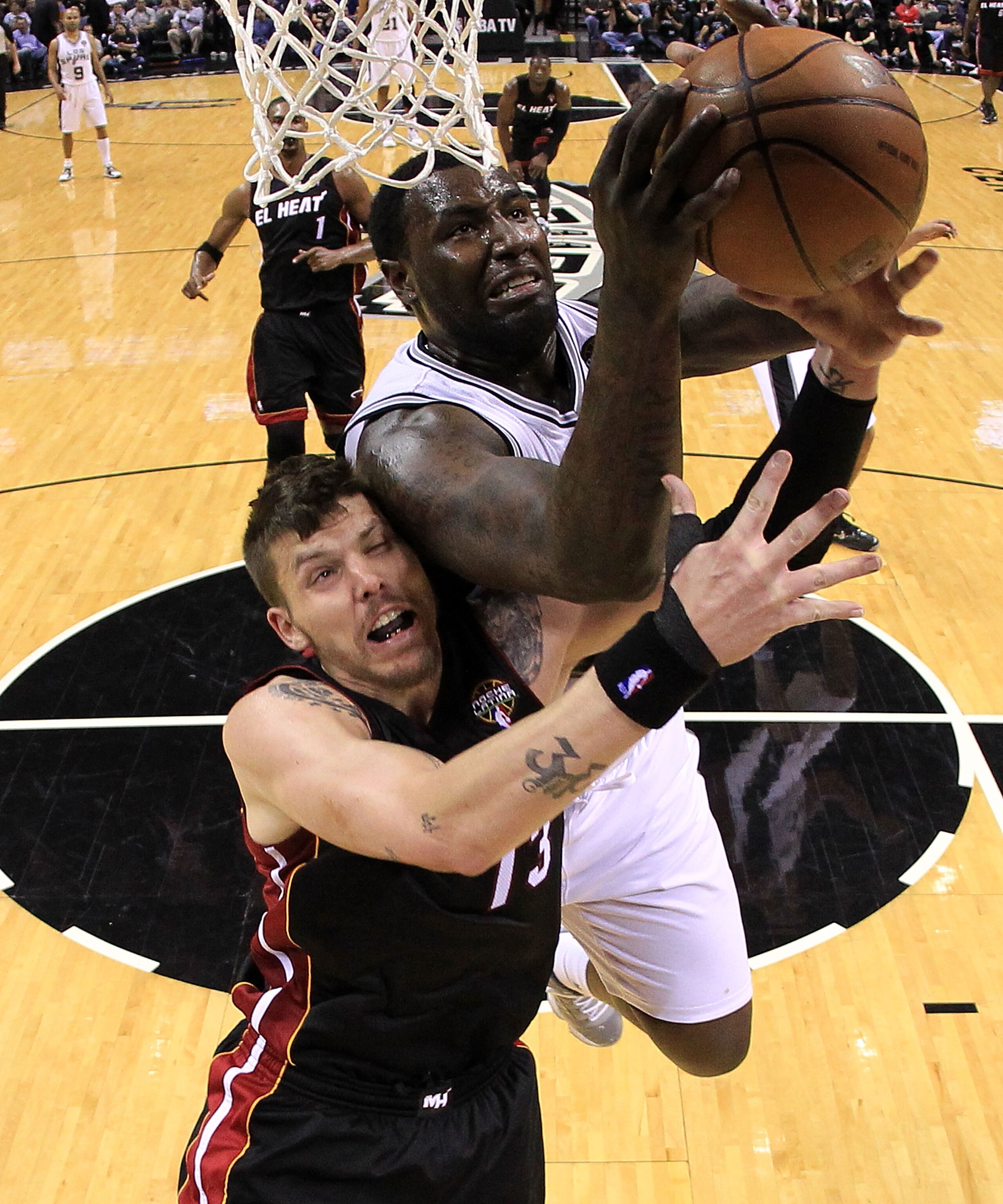 SAN ANTONIO, TX - MARCH 04:  Forward DeJuan Blair #45 of the San Antonio Spurs takes a shot against Mike Miller #13 of the Miami Heat at AT&T Center on March 4, 2011 in San Antonio, Texas.   NOTE TO USER: User expressly acknowledges and agrees that, by do