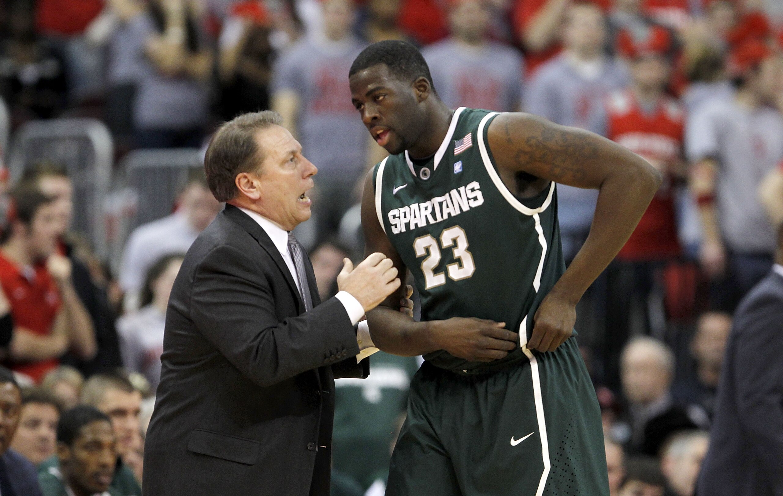 COLUMBUS, OH - FEBRUARY 15:  Head Coach Tom Izzo speaks with Draymond Green #23, both of the Michigan State Spartans, during the first half against the Ohio State Buckeyes on February 15, 2011 at Value City Arena in Columbus, Ohio.  (Photo by Gregory Sham