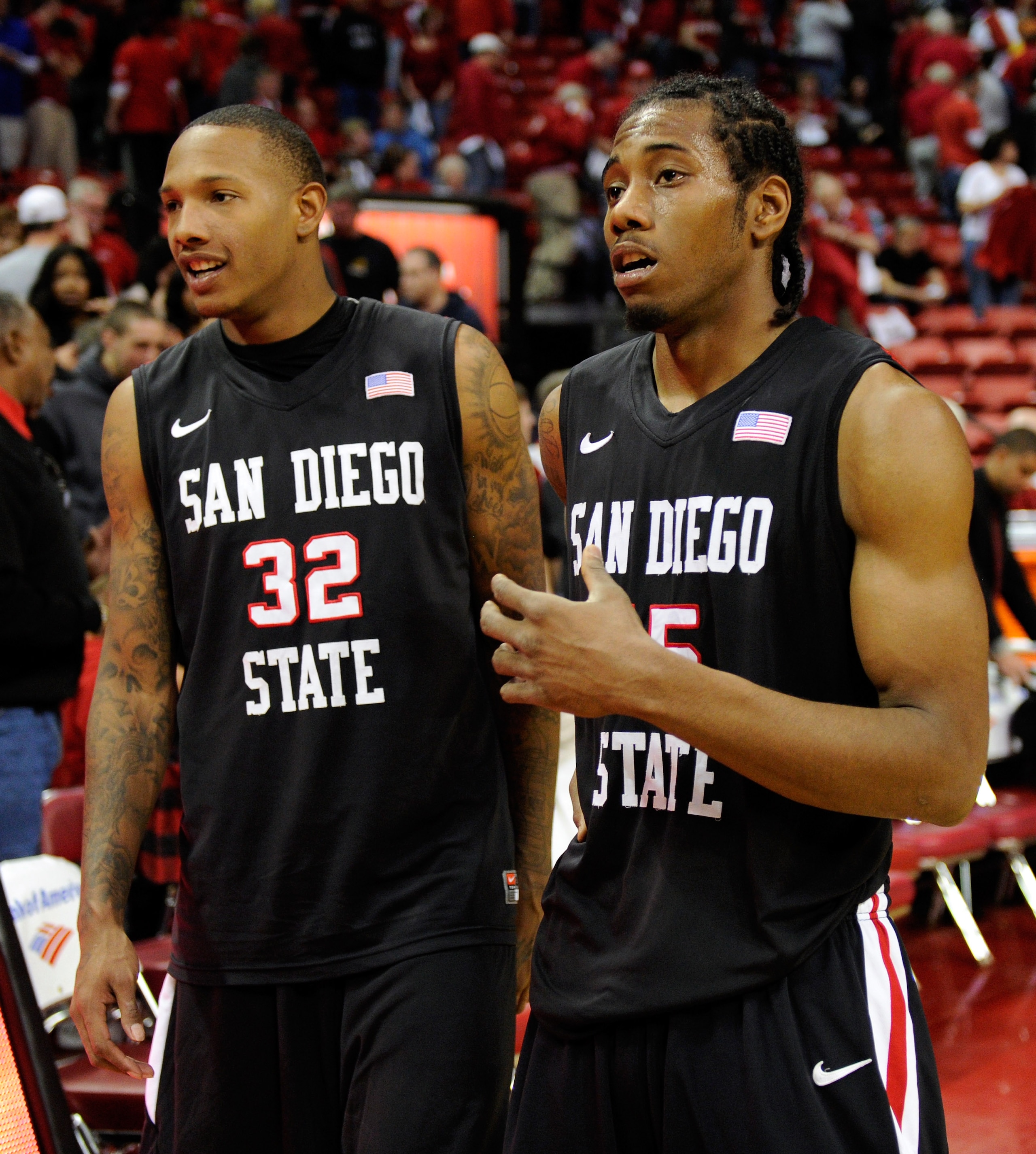 LAS VEGAS, NV - FEBRUARY 12:  Billy White #32 and and Kawhi Leonard #15 of the San Diego State Aztecs celebrate their 63-57 victory over the UNLV Rebels at the Thomas & Mack Center February 12, 2011 in Las Vegas, Nevada.  (Photo by Ethan Miller/Getty Imag