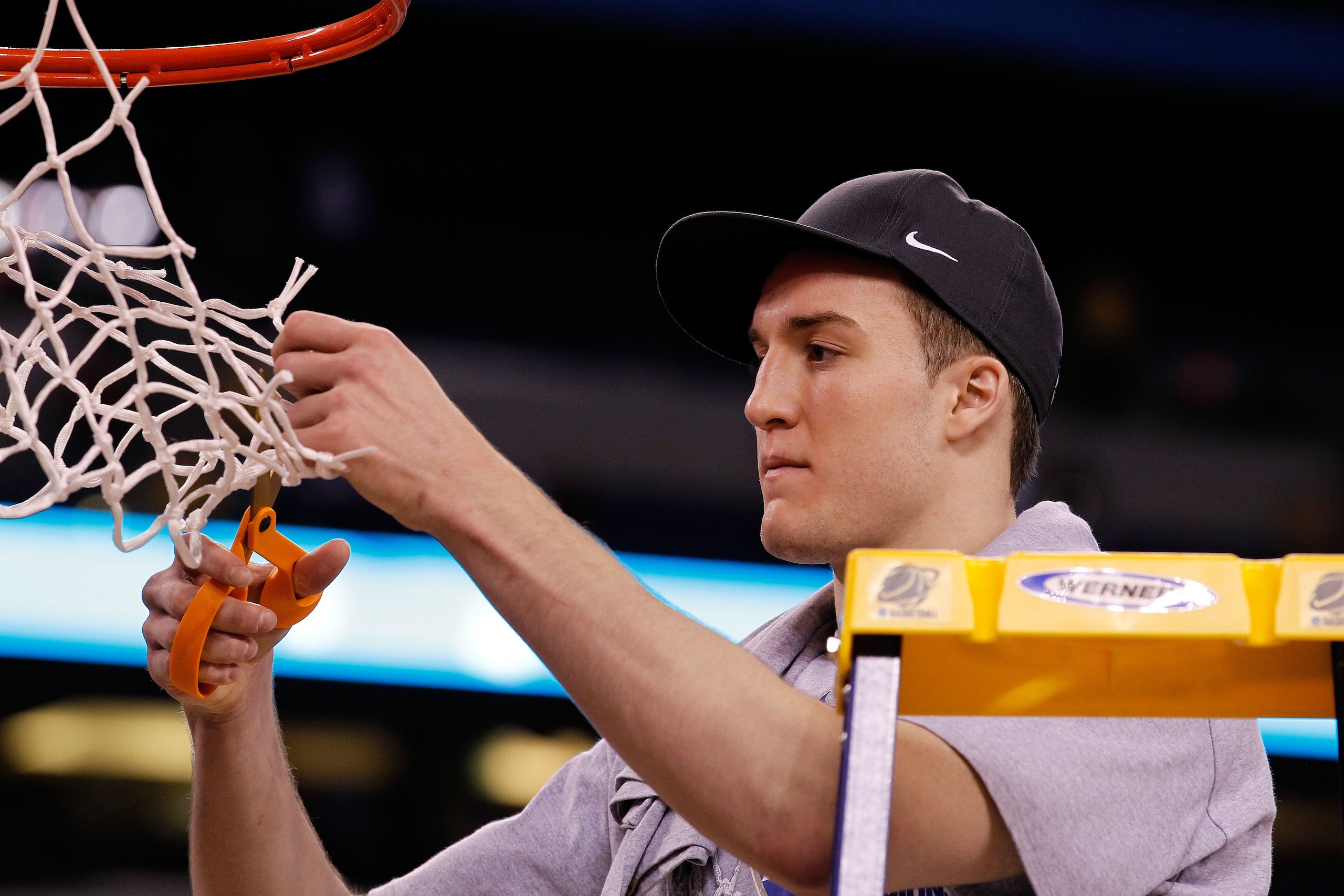 INDIANAPOLIS - APRIL 05: Miles Plumlee #21 of the Duke Blue Devils cuts down a piece of the net following their 61-59 win against the Butler Bulldogs during the 2010 NCAA Division I Men's Basketball National Championship game at Lucas Oil Stadium on Apri INDIANAPOLIS - APRIL 05: Miles Plumlee #21 of the Duke Blue Devils cuts down a piece of the net following their 61-59 win against the Butler Bulldogs during the 2010 NCAA Division I Men's Basketball National Championship game at Lucas Oil Stadium on Apri