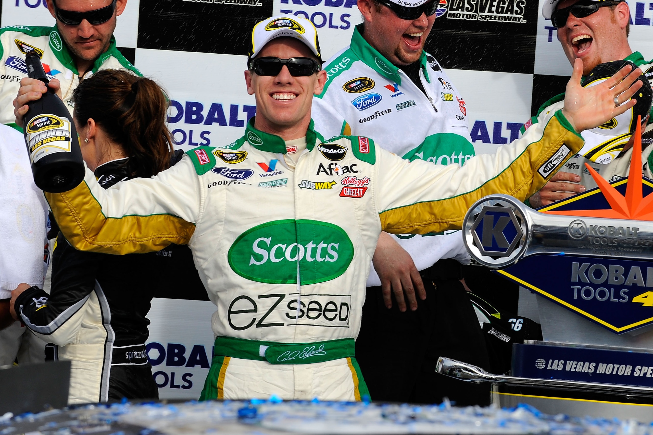 LAS VEGAS, NV - MARCH 06:  Carl Edwards, driver of the #99 Scotts/Kellogg's Ford, celebrates in Victory Lane after winning the NASCAR Sprint Cup Series Kobalt Tools 400 at Las Vegas Motor Speedway on March 6, 2011 in Las Vegas, Nevada.  (Photo by Jared C.