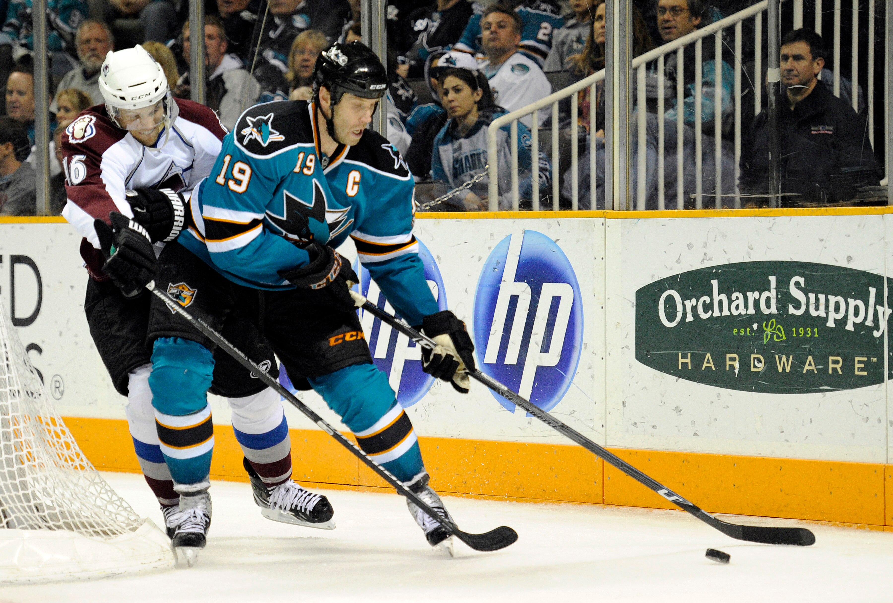SAN JOSE, CA - MARCH 1: Joe Thornton #19 of the San Jose Sharks keeps the puck away from Jay McClement #16 of the Colorado Avalanche in the second period during an NHL hockey game at the HP Pavilion on March 1, 2011 in San Jose, California. (Photo by Thea