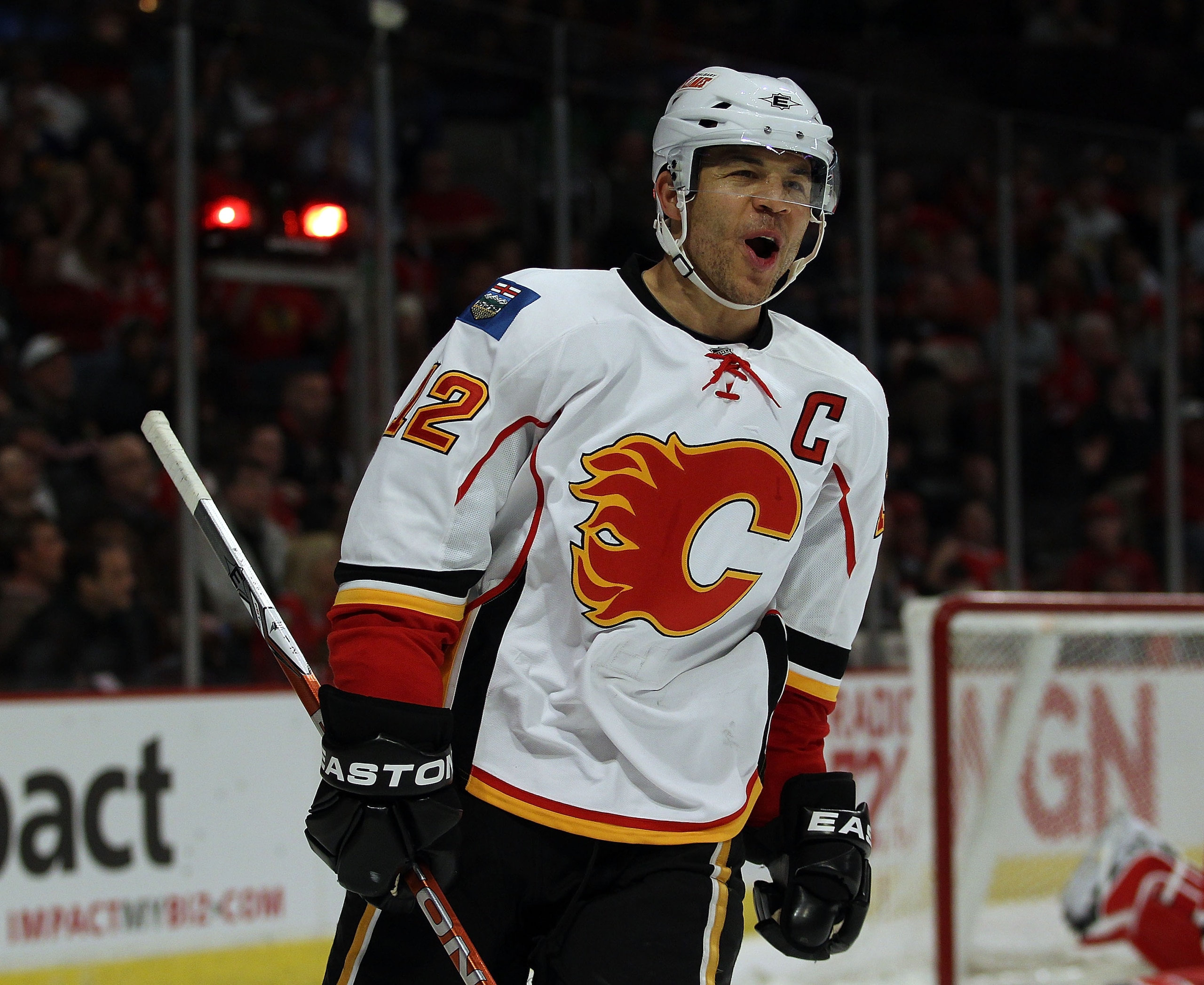 CHICAGO, IL - MARCH 02: Jarome Iginla #12 of the Calgary Flames celebrates a 3rd period goal by teammate Rene Bourque against the Chicago Blackhawks at the United Center on March 2, 2011 in Chicago, Illinois. The Blackhawks defeated the Flames 6-4. (Photo