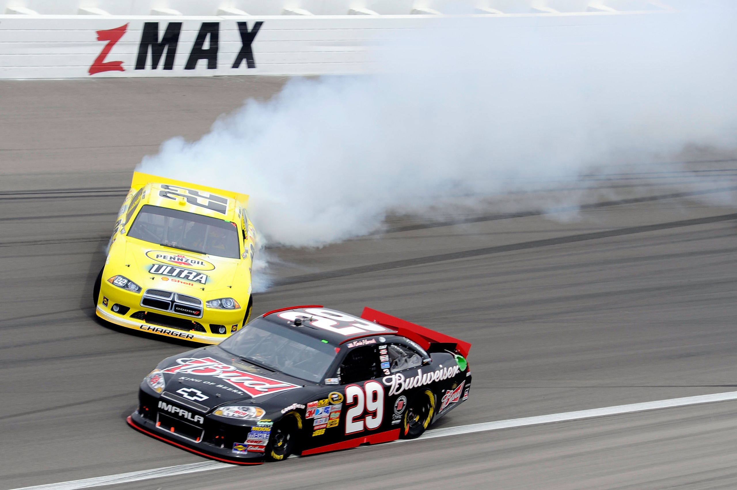 LAS VEGAS, NV - MARCH 06:  Kurt Busch, driver of the #22 Shell/Pennzoil Dodge, spins out ahead of Kevin Harvick, driver of the #29 Budweiser Chevrolet, after an incident in the NASCAR Sprint Cup Series Kobalt Tools 400 at Las Vegas Motor Speedway on March
