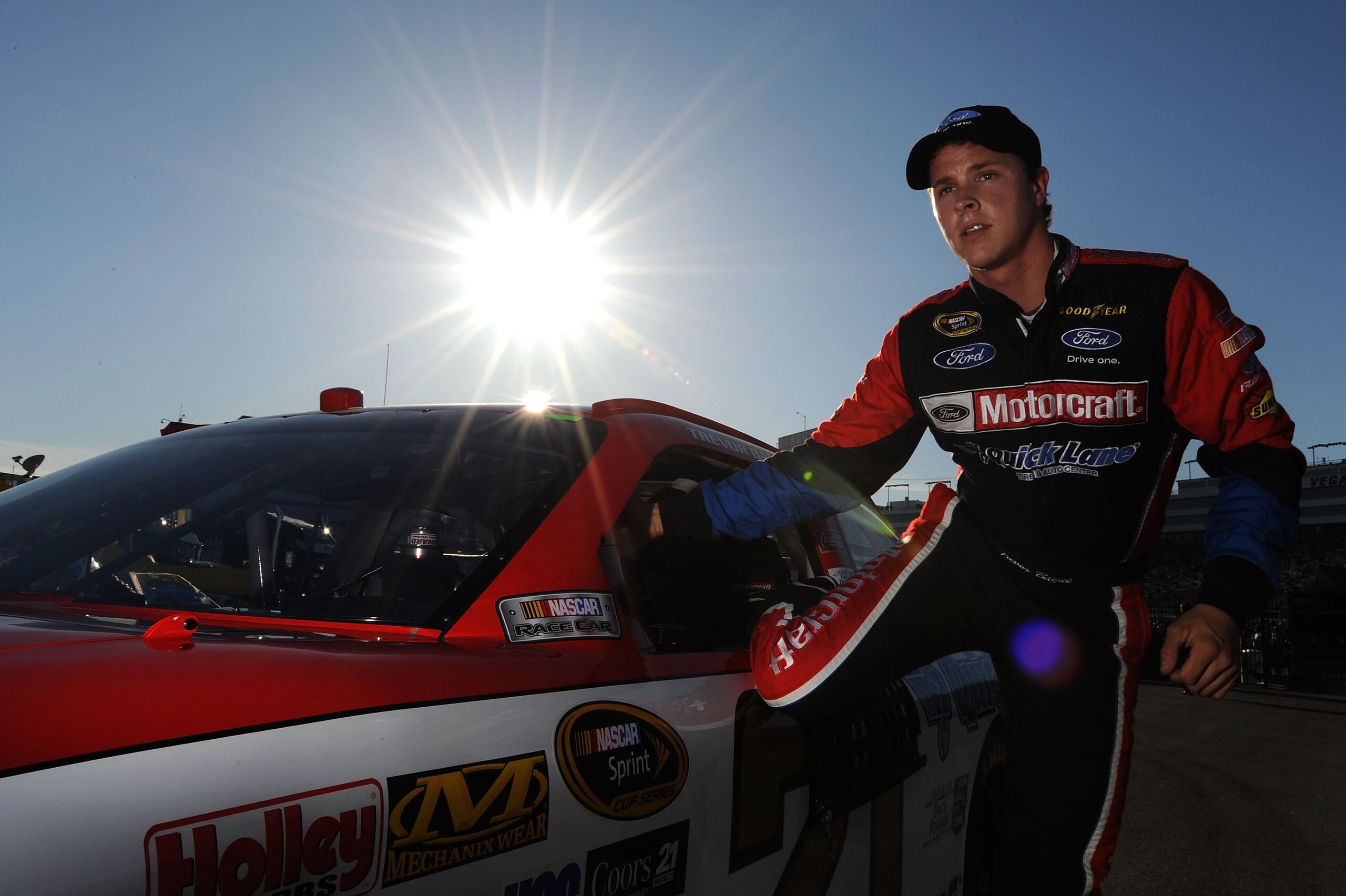 LAS VEGAS, NV - MARCH 04:  Trevor Bayne, driver of the #21 Motorcraft/Quick Lane Tire & Auto Center Ford, stands next to his car after qualifying for the NASCAR Sprint Cup Series Kobalt Tools 400 at Las Vegas Motor Speedway on March 4, 2011 in Las Vegas, 