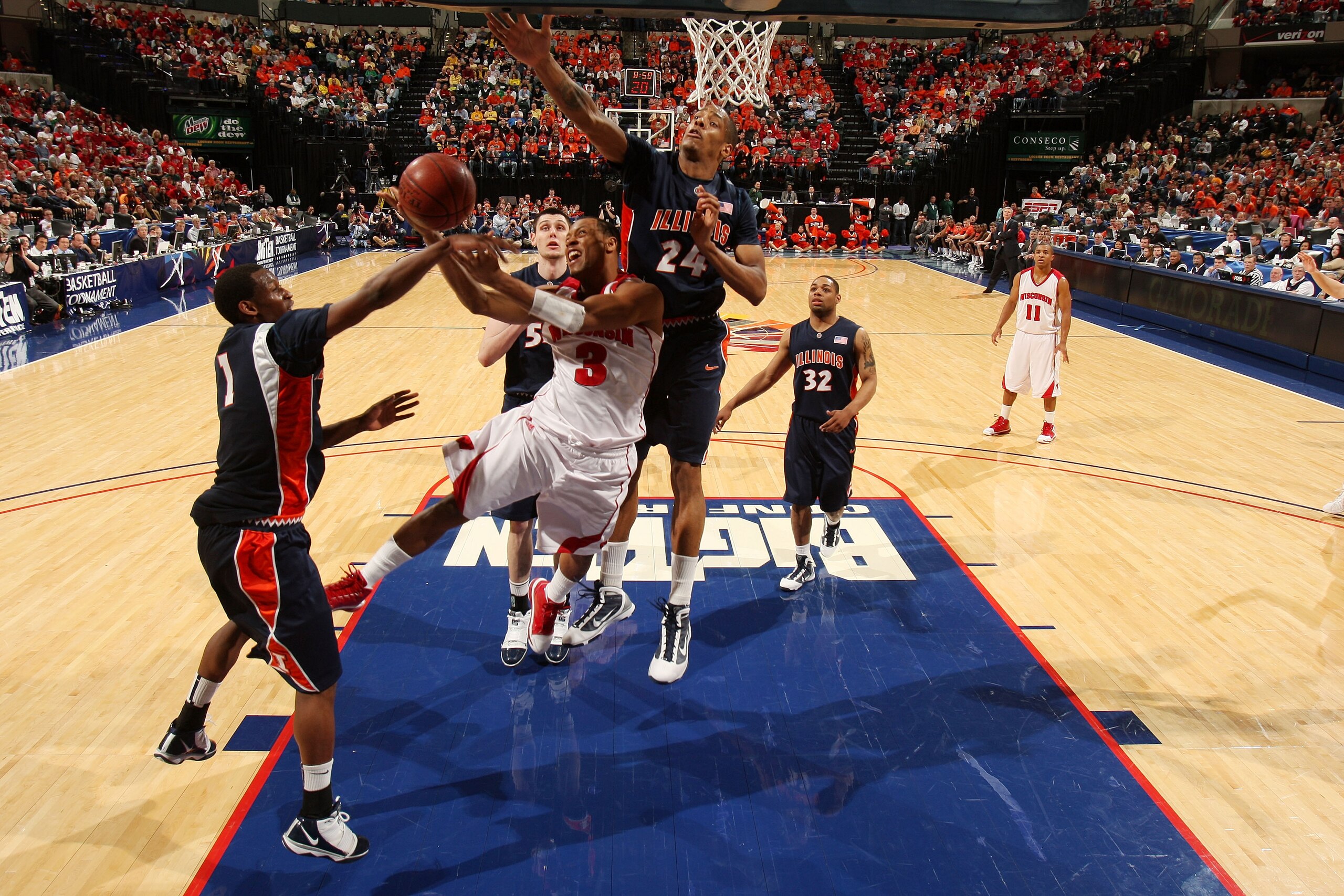 INDIANAPOLIS - MARCH 12:  Guard Trevon Hughes #3 of the Wisconsin Badgers is fouled as he attempts a shot against the Illinois Fighting Illini during the quarterfinals of the Big Ten Men's Basketball Tournament at Conseco Fieldhouse on March 12, 2010 in I