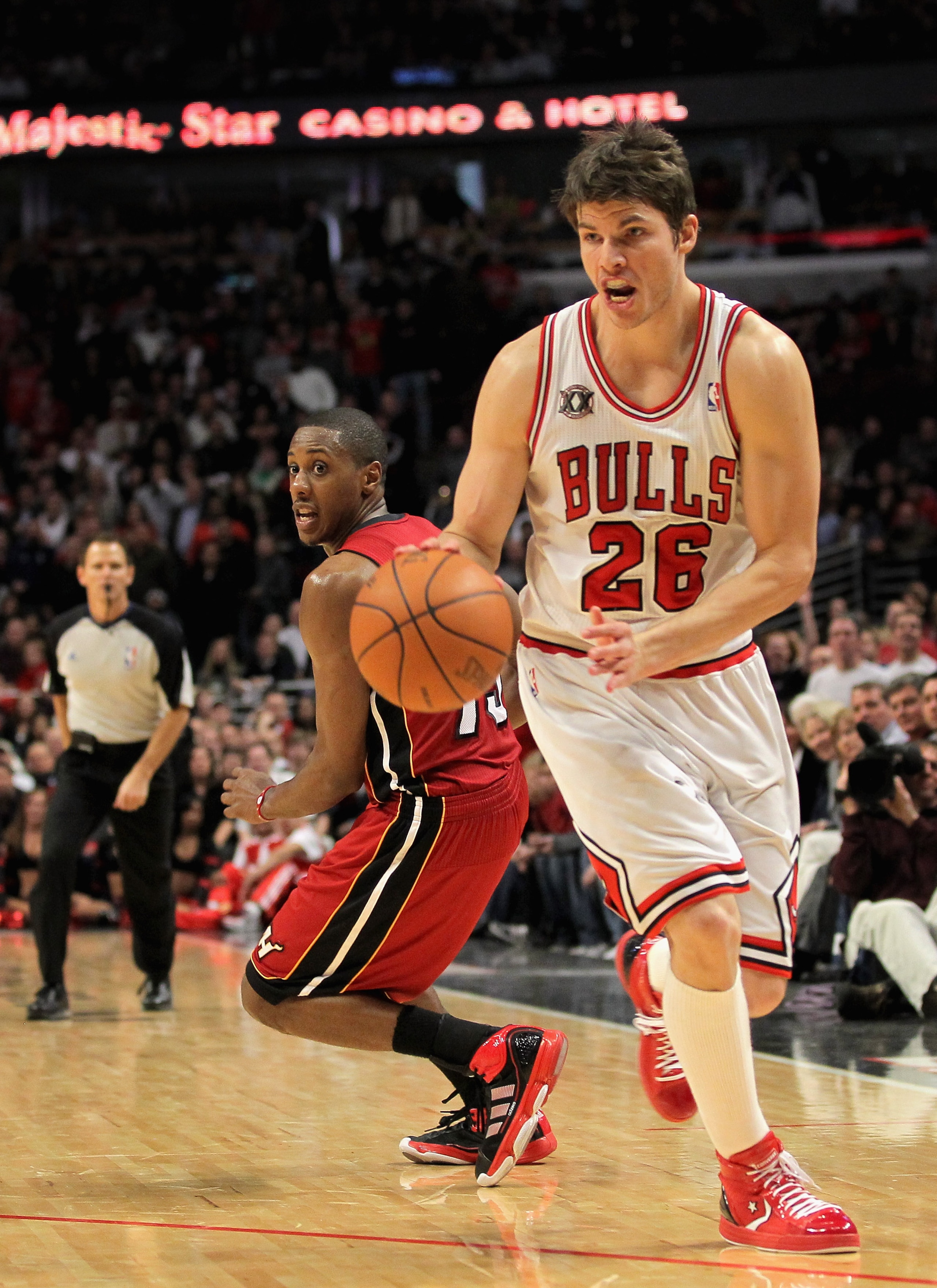 CHICAGO, IL - JANUARY 15:  Kyle Korver #26 of the Chicago Bulls collects a rebound and sets up for the game winning three point field goal with 25 seconds remaining in the game against Mario Chamlers #15 of the Miami Heat at the United Center on January 1