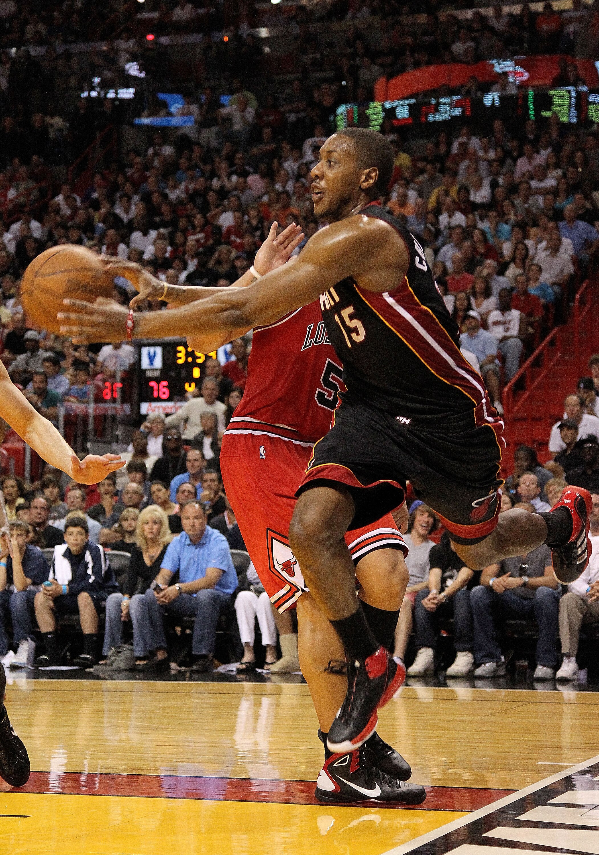 MIAMI, FL - MARCH 06: Mario Chalmers #15 of the Miami Heat chases down a loose ball during a game against the Chicago Bulls at American Airlines Arena on March 6, 2011 in Miami, Florida. NOTE TO USER: User expressly acknowledges and agrees that, by downlo MIAMI, FL - MARCH 06: Mario Chalmers #15 of the Miami Heat chases down a loose ball during a game against the Chicago Bulls at American Airlines Arena on March 6, 2011 in Miami, Florida. NOTE TO USER: User expressly acknowledges and agrees that, by downlo