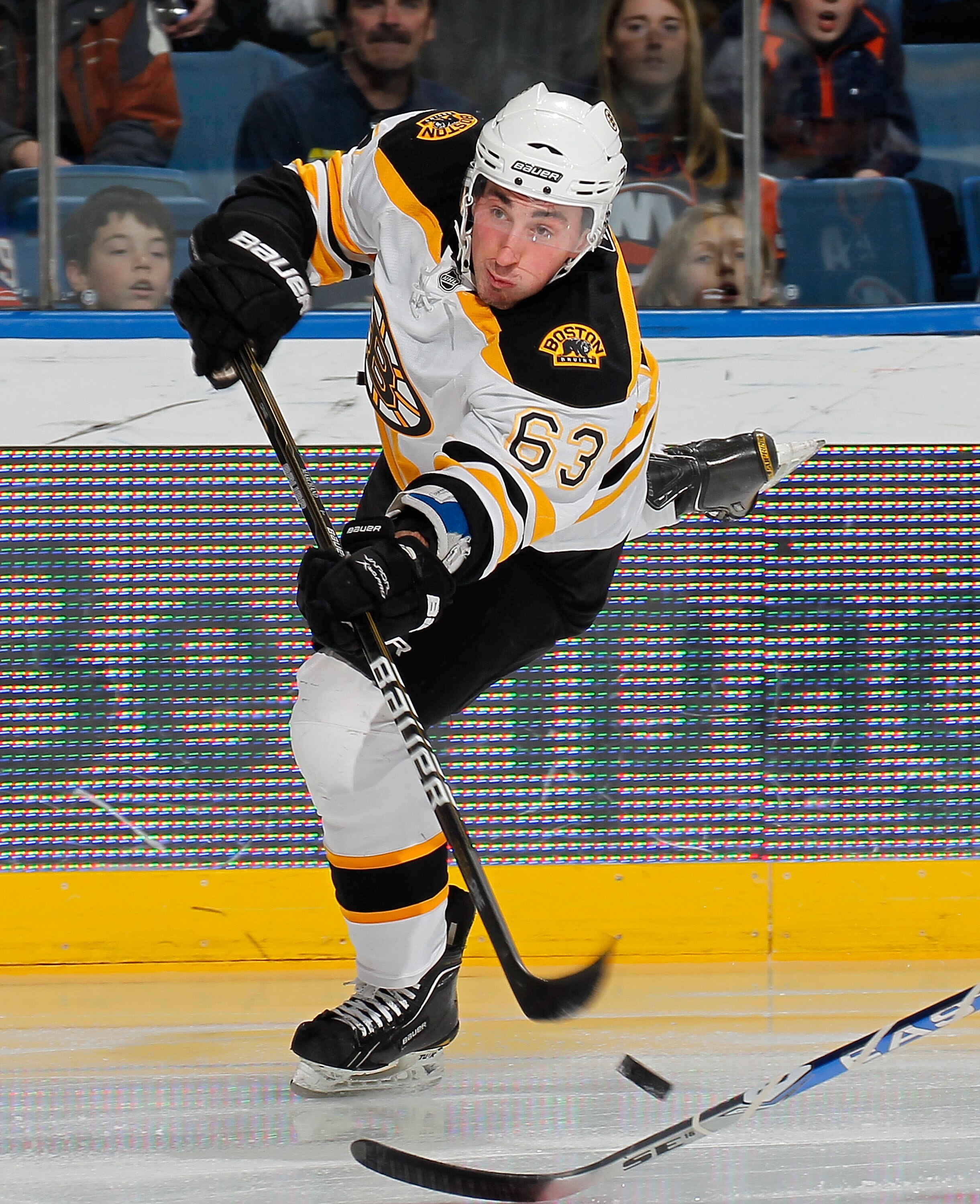 UNIONDALE, NY - FEBRUARY 17:  Brad Marchand #63 of the Boston Bruins shoots during an NHL hockey game against the New York Islanders at the Nassau Coliseum on February 17, 2011 in Uniondale, New York.  (Photo by Paul Bereswill/Getty Images)