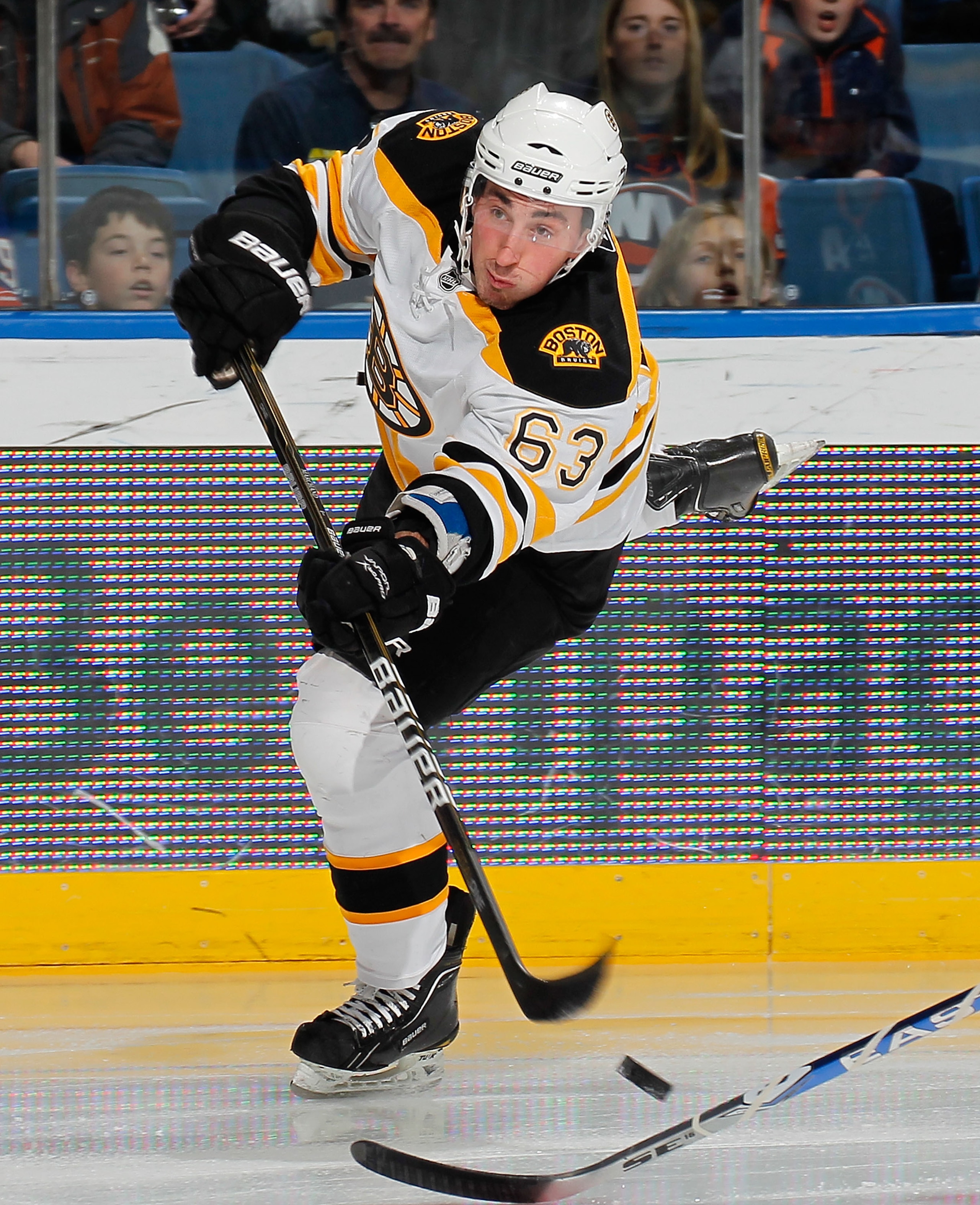 UNIONDALE, NY - FEBRUARY 17:  Brad Marchand #63 of the Boston Bruins shoots during an NHL hockey game against the New York Islanders at the Nassau Coliseum on February 17, 2011 in Uniondale, New York.  (Photo by Paul Bereswill/Getty Images)