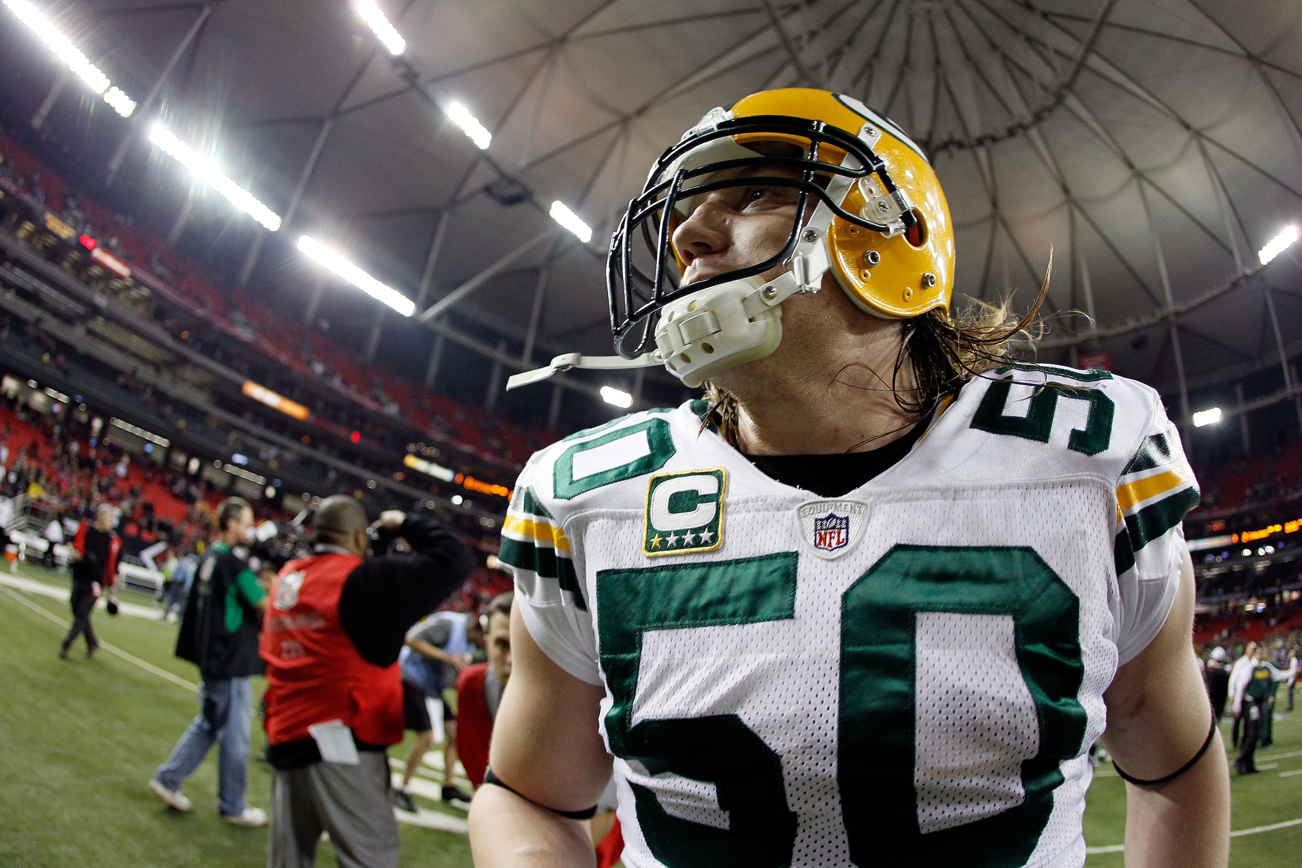 ATLANTA, GA - JANUARY 15:  A.J. Hawk #50 of the Green Bay Packers celebrates as he walks off the field after they won 48-21 against the Atlanta Falcons during their 2011 NFC divisional playoff game at Georgia Dome on January 15, 2011 in Atlanta, Georgia.