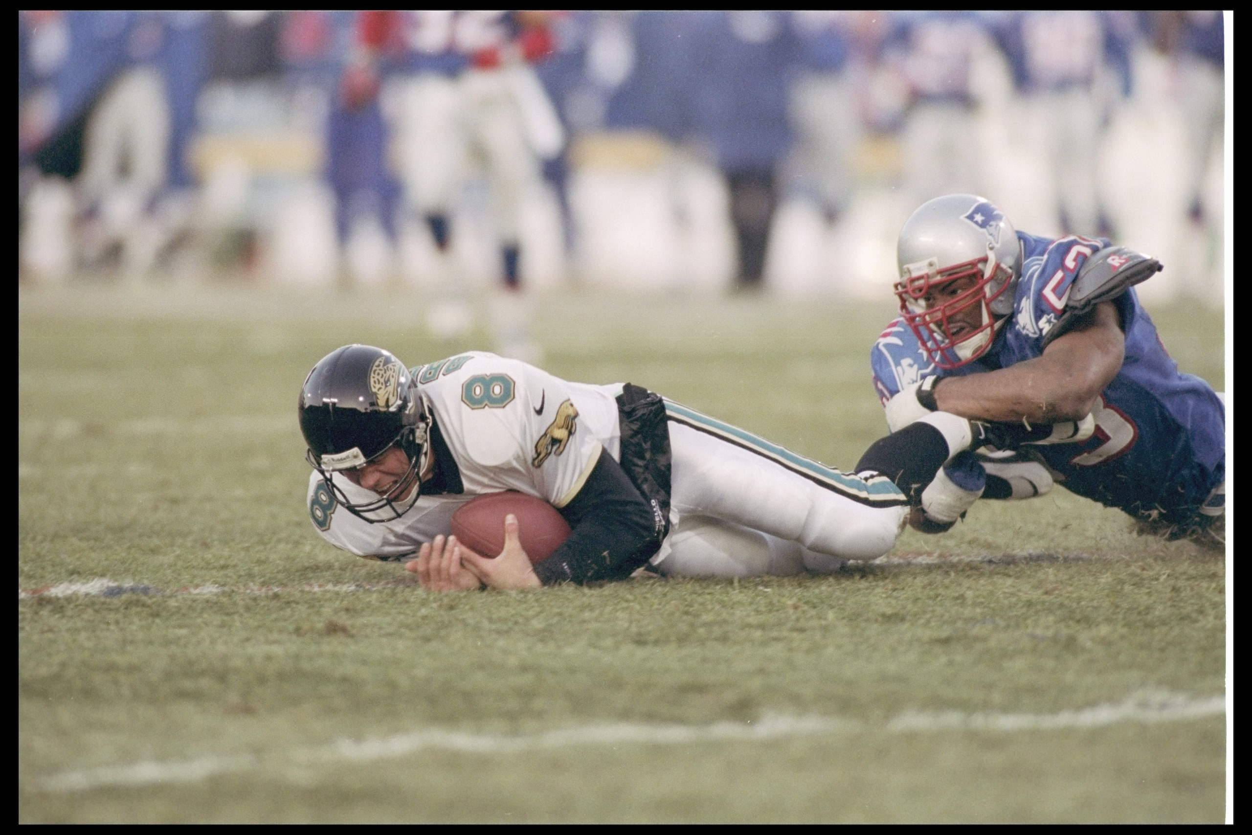 12 Jan 1997:   Linebacker Chris Slade #53 of the New England Patriots brings down quarterback Mark Brunell #8 of the Jacksonville Jaguars during the AFC Championship game played at the Foxboro Stadium in Foxboro, Massachusetts.  The  Patriots won,  20-16.