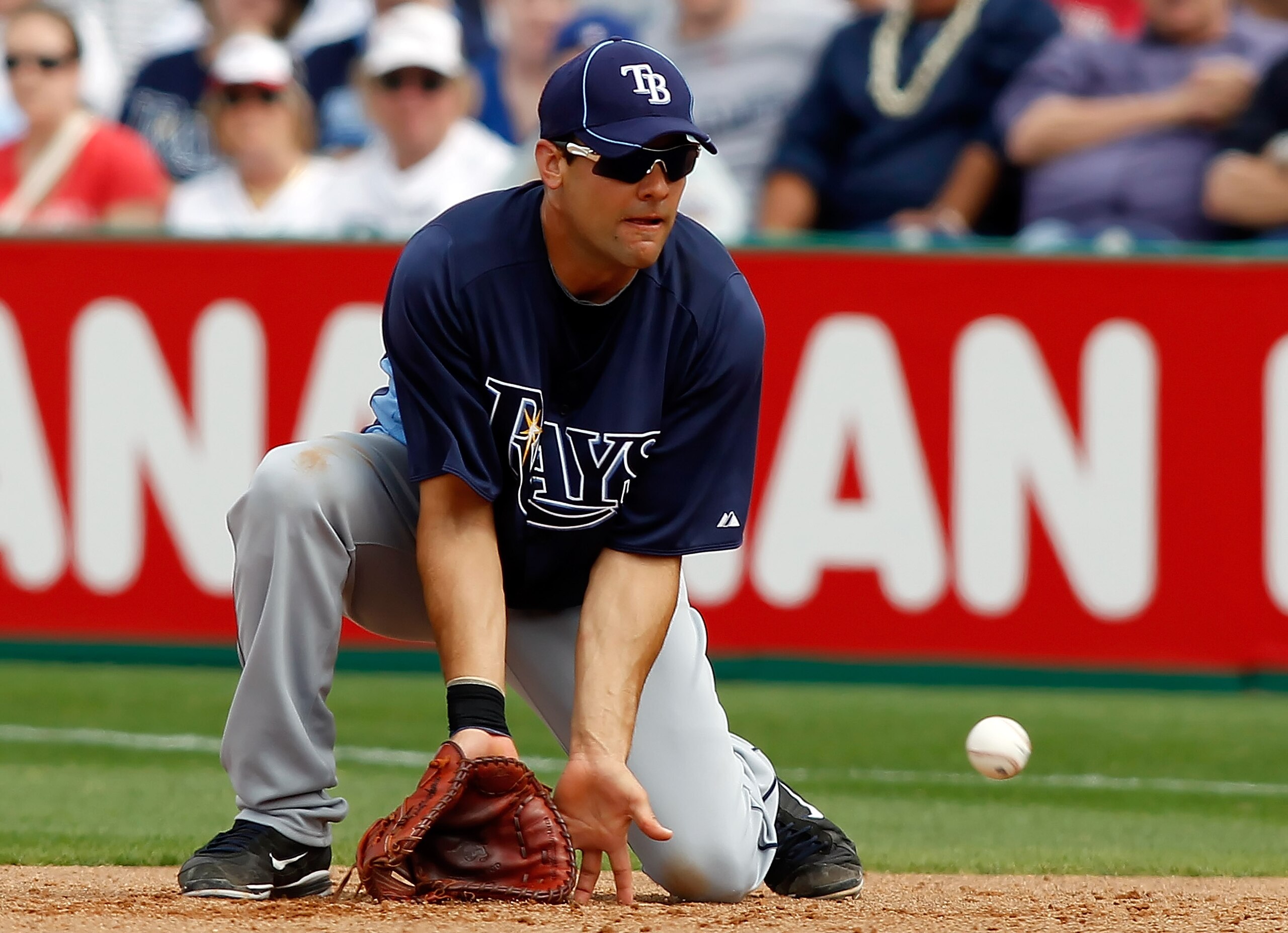 CLEARWATER, FL - MARCH 06:  First baseman Casey Kotchman #23 of the Tampa Bay Rays fields this ground ball against the Philadelphia Phillies during a Grapefruit League Spring Training Game at Bright House Field on March 6, 2011 in Sarasota, Florida.  (Pho