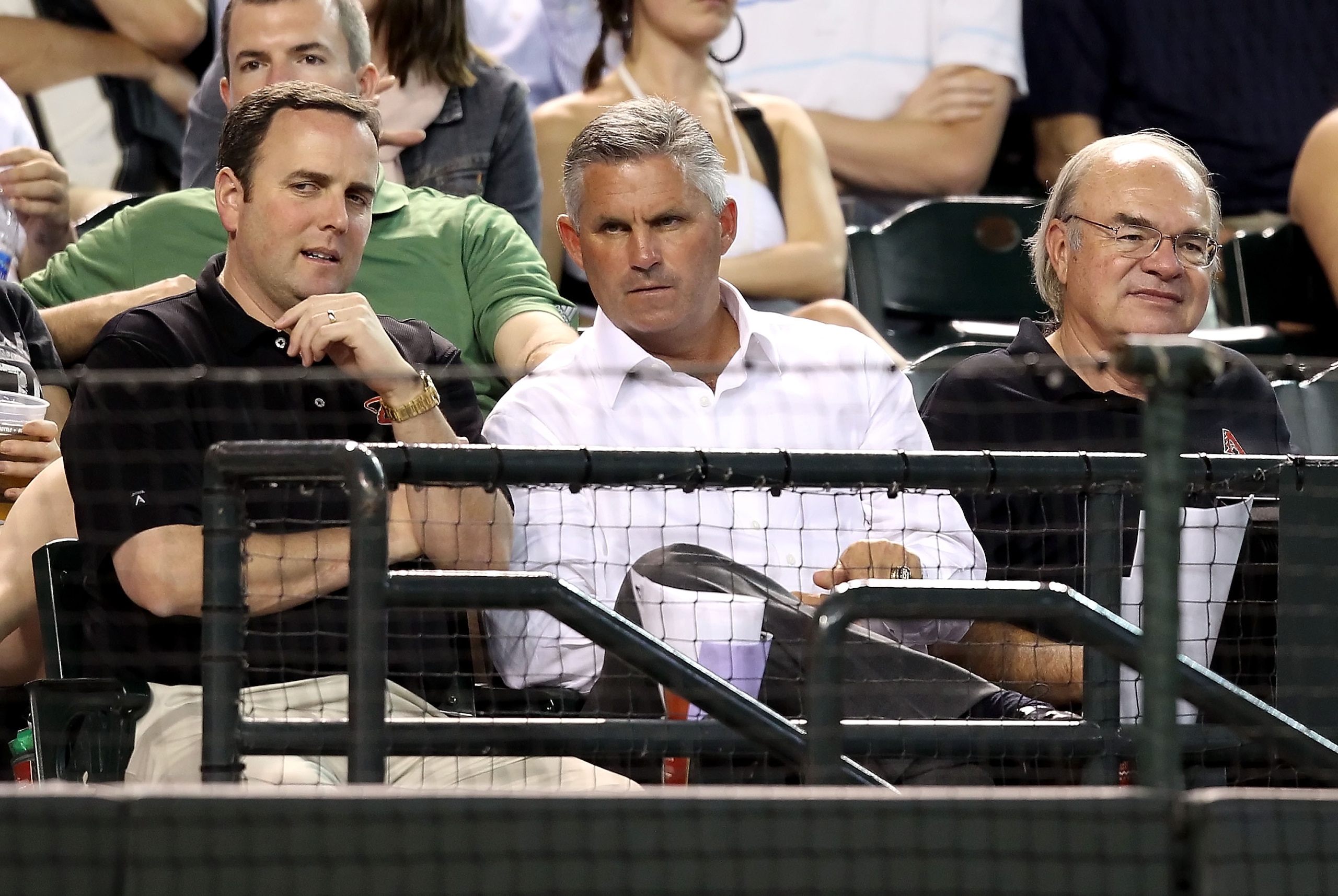PHOENIX - SEPTEMBER 22:  (L-R) President & Chief Executive Officer Derrick Hall, Executive Vice President & General Manager Kevin Towers and Managing General Partner Ken Kendrick of the Arizona Diamondbacks attend the Major League Baseball game against th