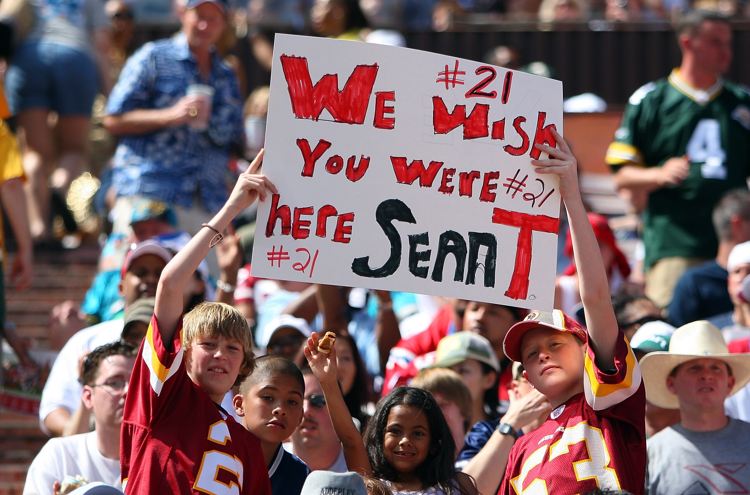HONOLULU, HI - FEBRUARY 10:  Young fans hold up a sign in memory of Sean Taylor #21 of the NFC's Washington Redskins during the game against the AFC at the 2008 NFL Pro Bowl at Aloha Stadium on February 10, 2008 in Honolulu, Hawaii. (Photo by Paul Spinell