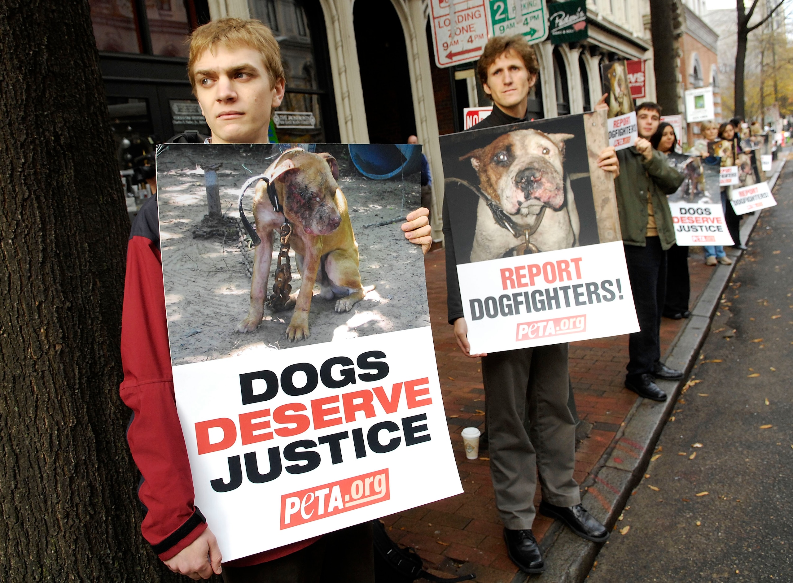 RICHMOND, VA - DECEMBER 10:  Animals rights activists Joel Bartlett (L) and Eric Deardorff (2nd L) wait outside a sentencing hearing for Atlanta Falcons quarterback Michael Vick in federal court December 10, 2007 in Richmond, Virginia. Vick and three asso