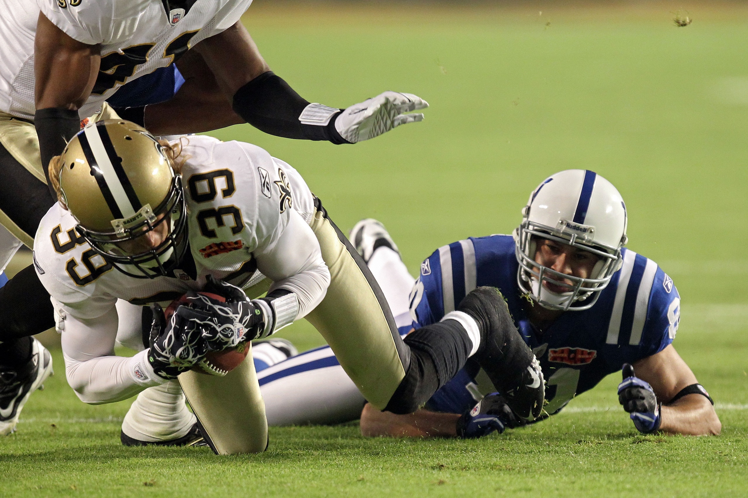 MIAMI GARDENS, FL - FEBRUARY 07:  Chris Reis #39 of the New Orleans Saints fight for the ball against Hank Baskett #81 of the Indianapolis Colts after a onside kick to start the second half with during Super Bowl XLIV on February 7, 2010 at Sun Life Stadi