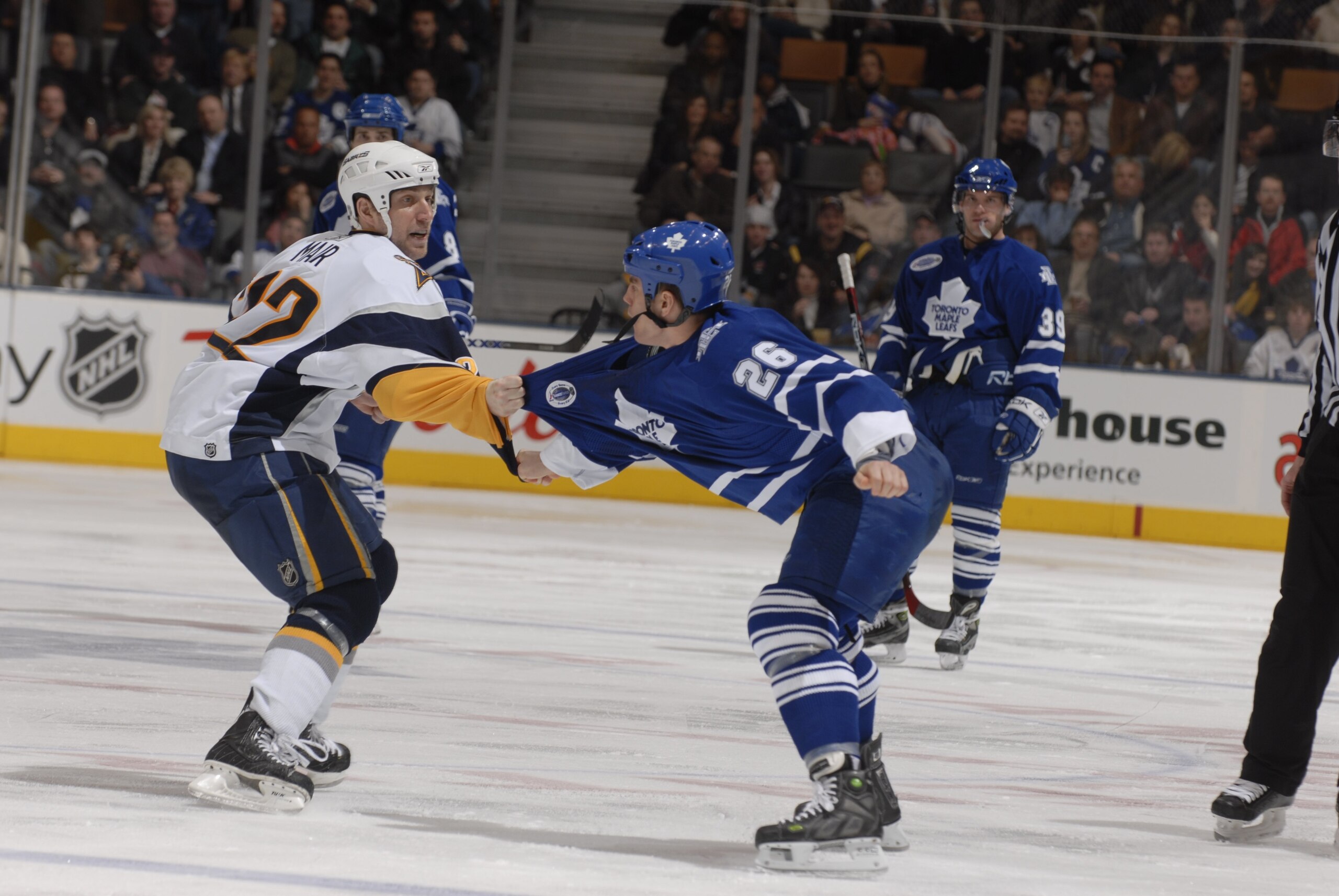 TORONTO - JANUARY 6:  Ben Ondrus #26 of the Toronto Maple Leafs fights against Adam Mair #22 of the Buffalo Sabres at Air Canada Centre on January 6, 2007 in Toronto, Ontario, Canada. The Sabres won 4-3. (Photo by Dave Abel/Getty Images)
