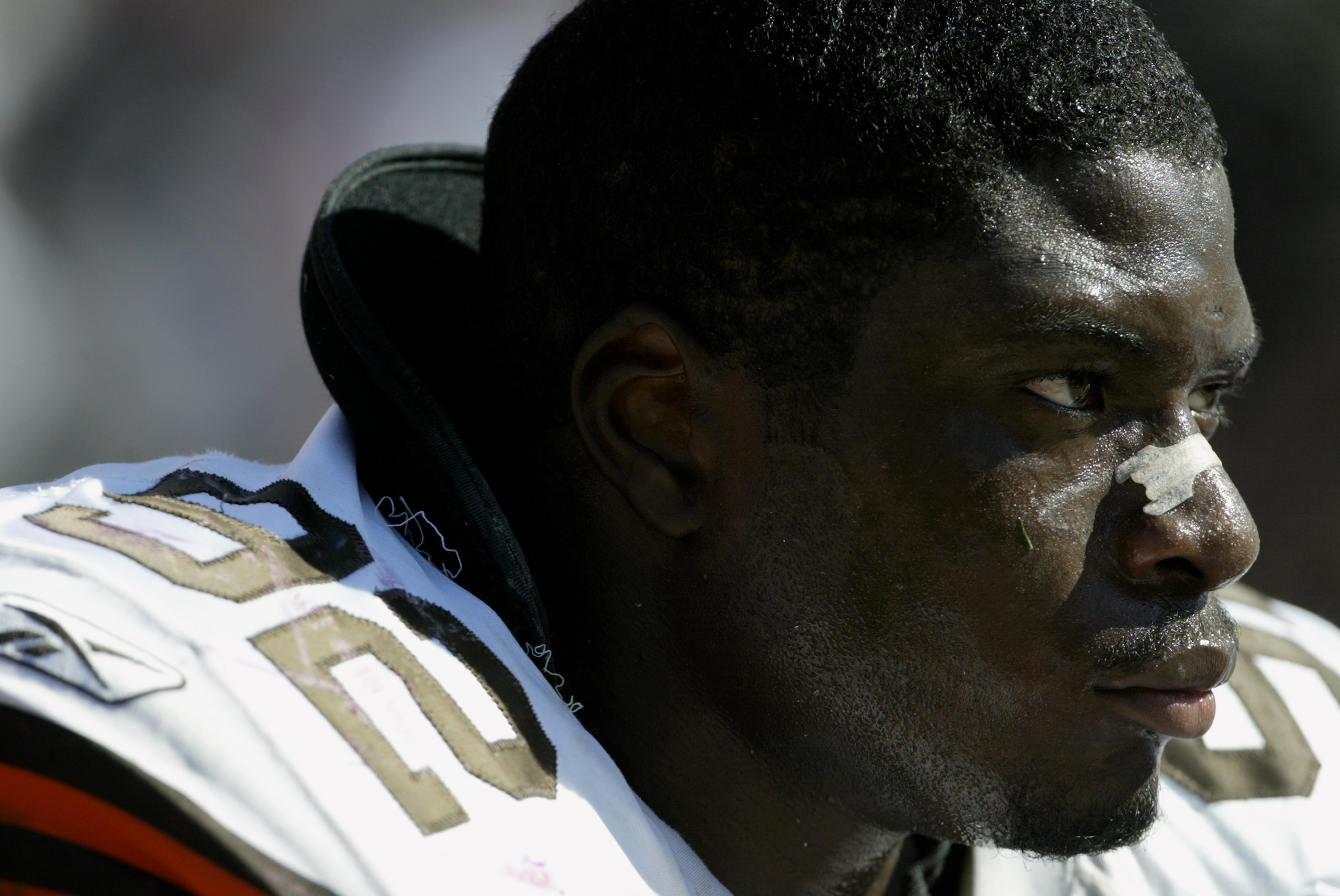 SAN FRANCISCO - SEPTEMBER 21:  Defensive lineman Courtney Brown #92 of the Cleveland Browns watches the game against the San Francisco 49ers at Candlestick Park on September 21, 2003 in San Francisco, California. The Browns defeated the 49ers 13-12. (Phot