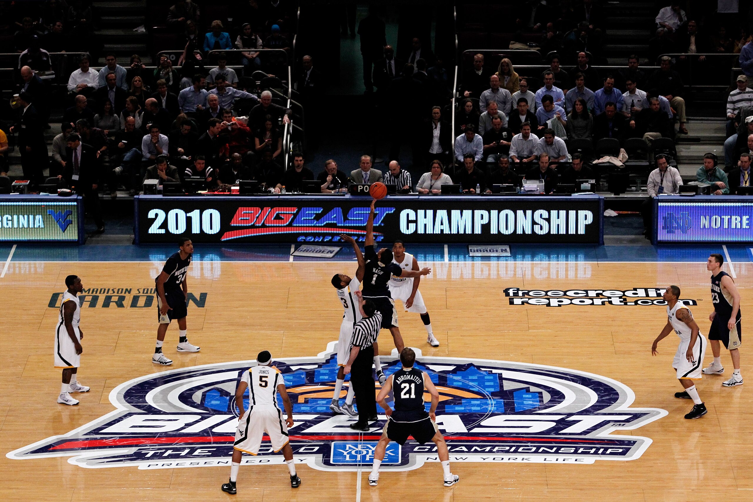 NEW YORK - MARCH 12:  Tyrone Nash #1 of the Notre Dame Fighting Irish tips the ball off against Devin Ebanks #3 of the West Virginia Mountaineers during the semifinal of the 2010 Big East Tournament at Madison Square Garden on March 12, 2010 in New York C
