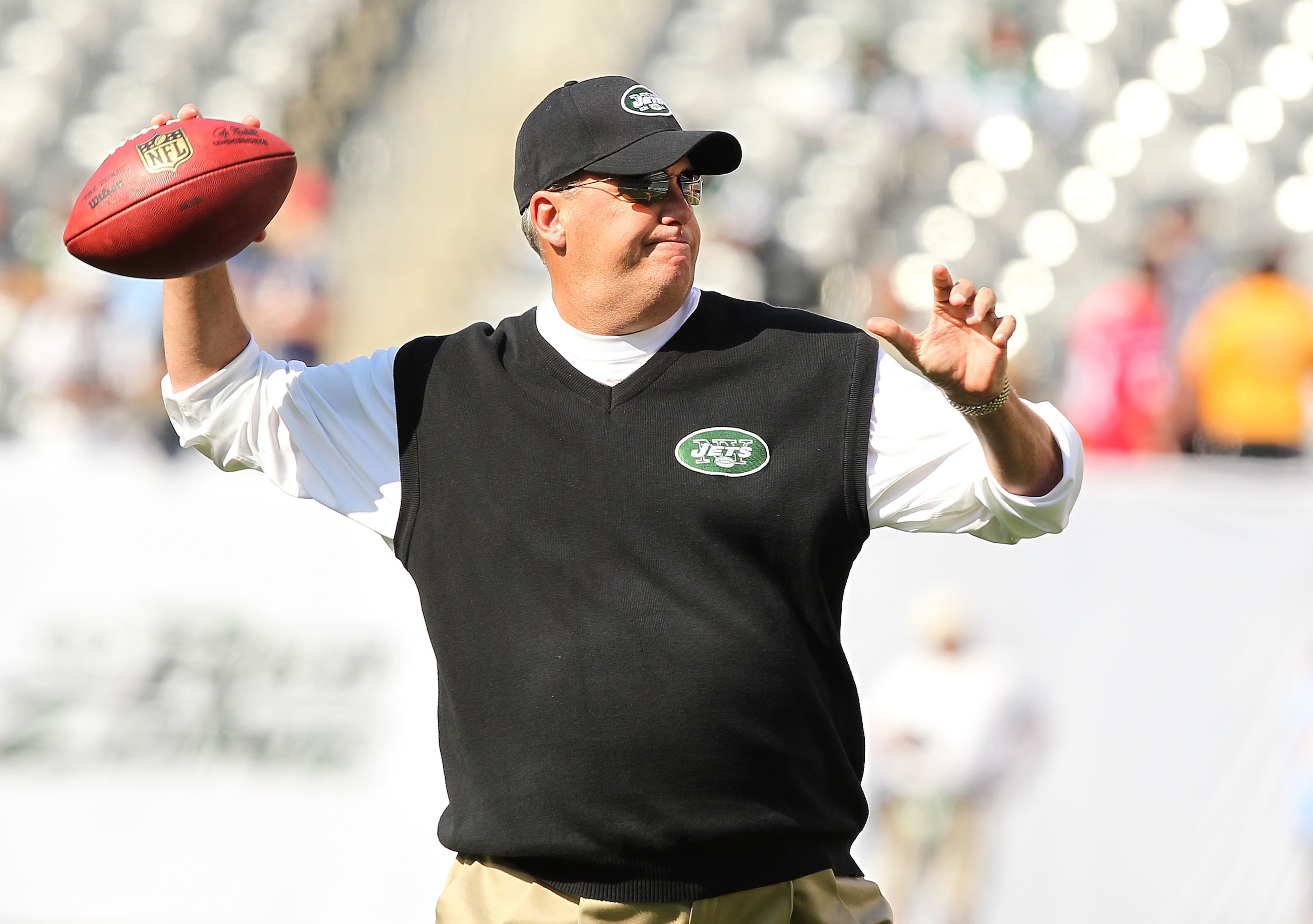 EAST RUTHERFORD, NJ - SEPTEMBER 19:  Head coach Rex Ryan of the New York Jets throws passes before the game against the New England Patriots on September 19, 2010 at the New Meadowlands Stadium in East Rutherford, New Jersey.  (Photo by Al Bello/Getty Ima
