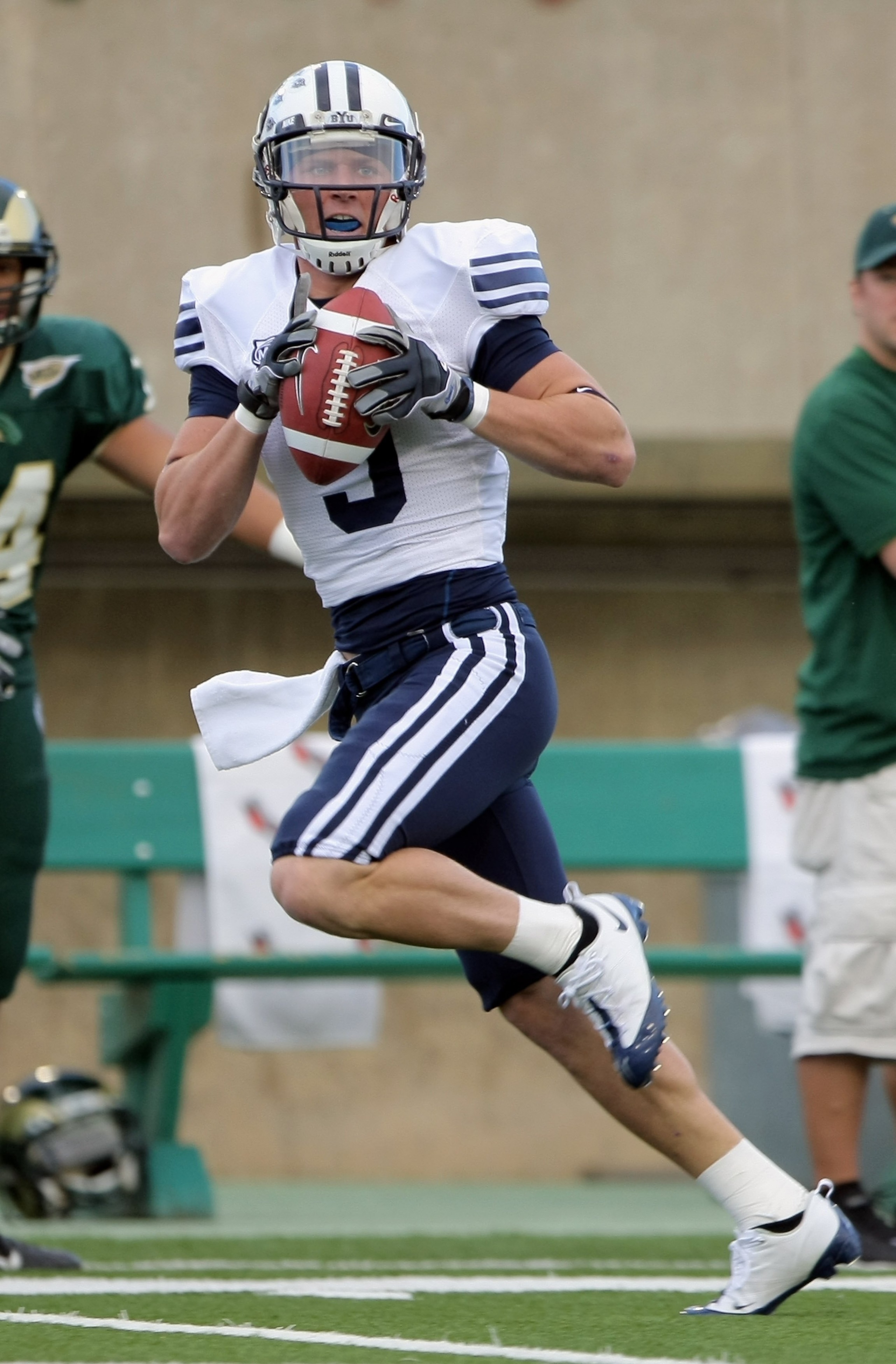 FORT COLLINS, CO - NOVEMBER 01: Austin Collie #9 of the Brigham Young Cougars makes a pass reception against the Colorado State Rams at Sonny Lubick Field at Hughes Stadium on November 1, 2008 in Fort Collins, Colorado. BYU defeated CSU 45-52. (Photo by FORT COLLINS, CO - NOVEMBER 01: Austin Collie #9 of the Brigham Young Cougars makes a pass reception against the Colorado State Rams at Sonny Lubick Field at Hughes Stadium on November 1, 2008 in Fort Collins, Colorado. BYU defeated CSU 45-52. (Photo by