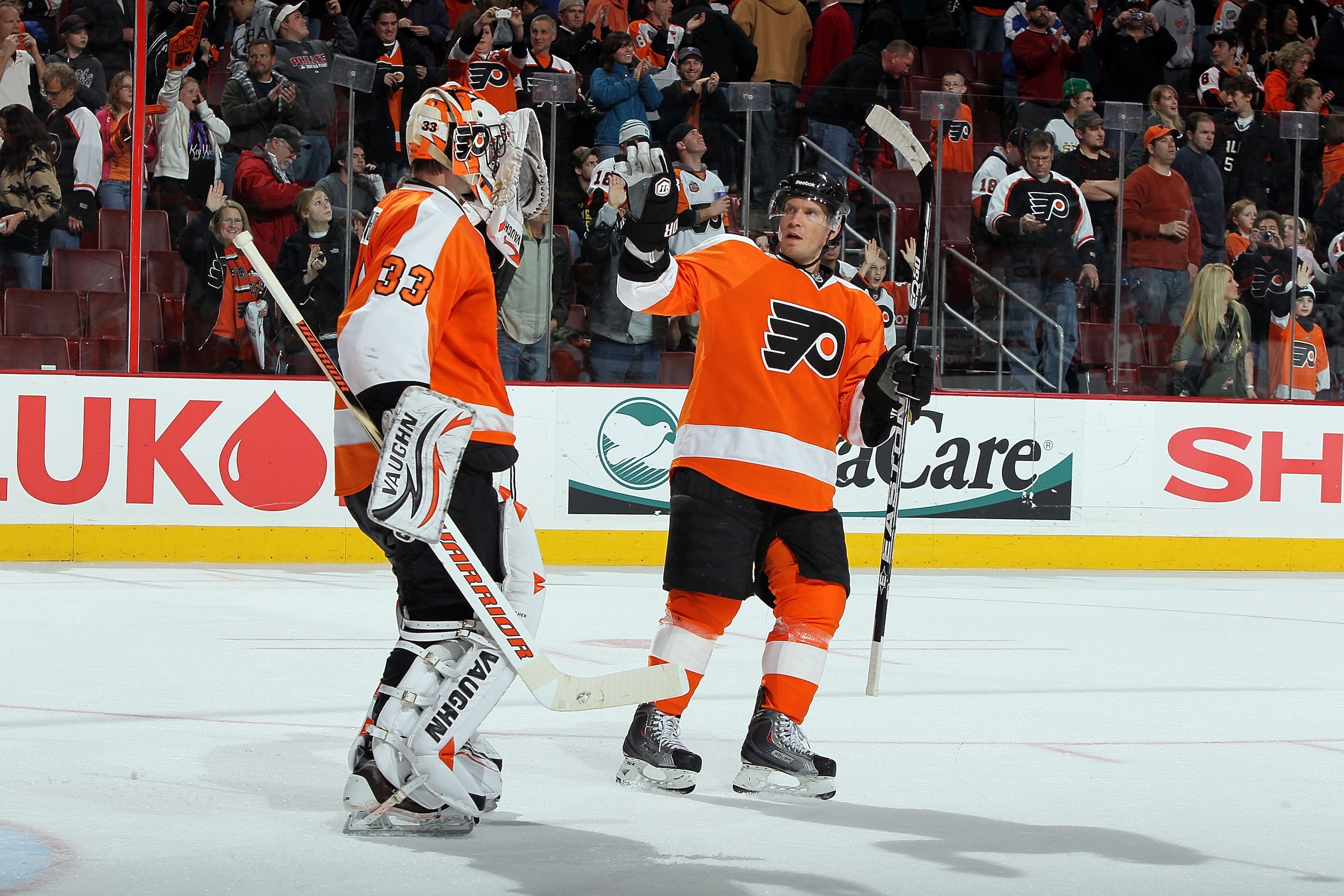 PHILADELPHIA, PA - FEBRUARY 05:  Kimmo Timonen #44 and Brian Boucher #33 of the Philadelphia Flyers celebrate against the Dallas Stars on February 5, 2011 at Wells Fargo Center in Philadelphia, Pennsylvania. The Flyers defeated the Stars 3-1.  (Photo by J