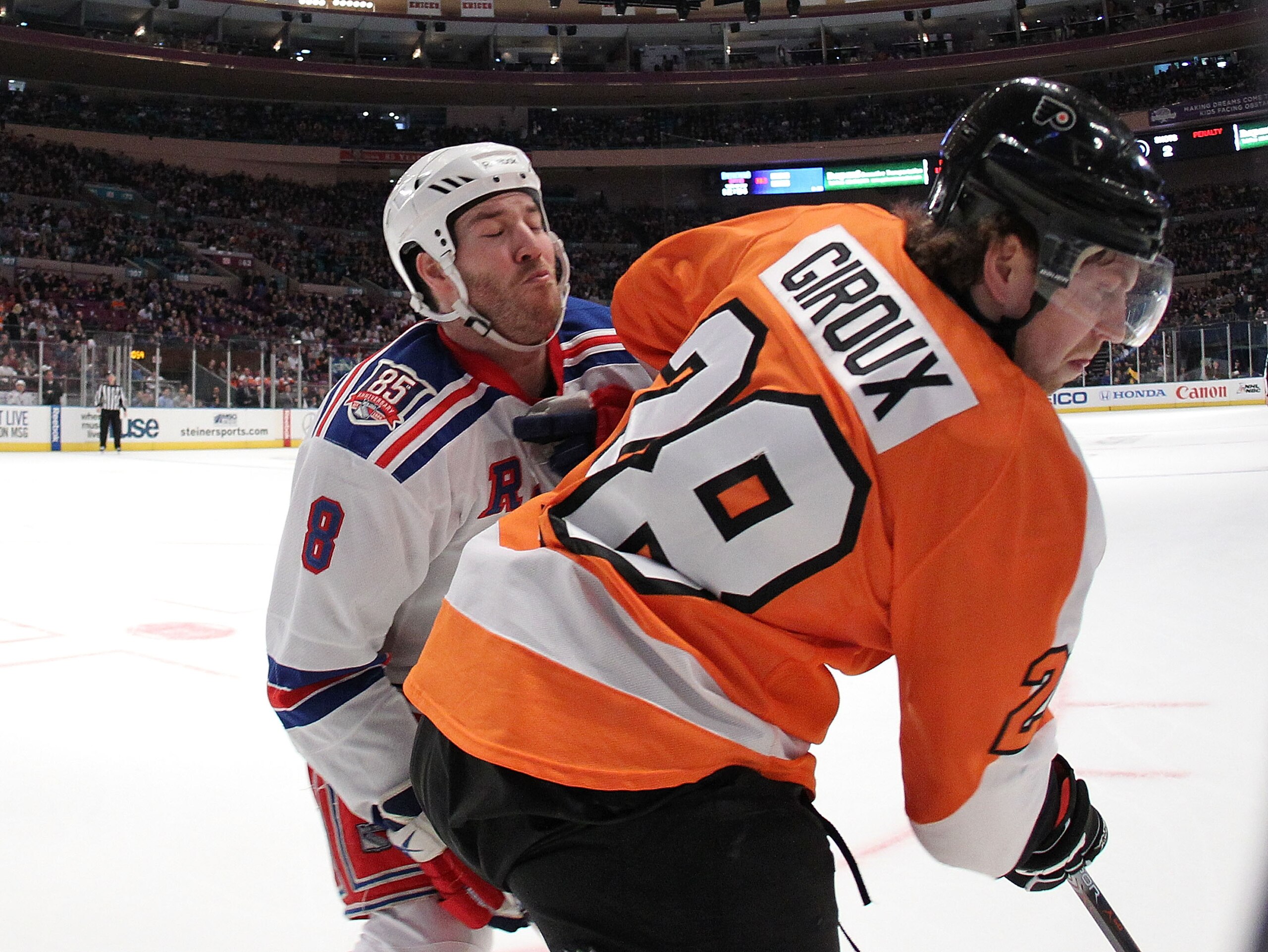 NEW YORK - MARCH 06:  Brandon Prust #8 of the New York Rangers checks Claude Giroux #28 of the Philadelphia Flyers during their game on March 6, 2011 at Madison Square Garden in New York City, New York.  (Photo by Al Bello/Getty Images)